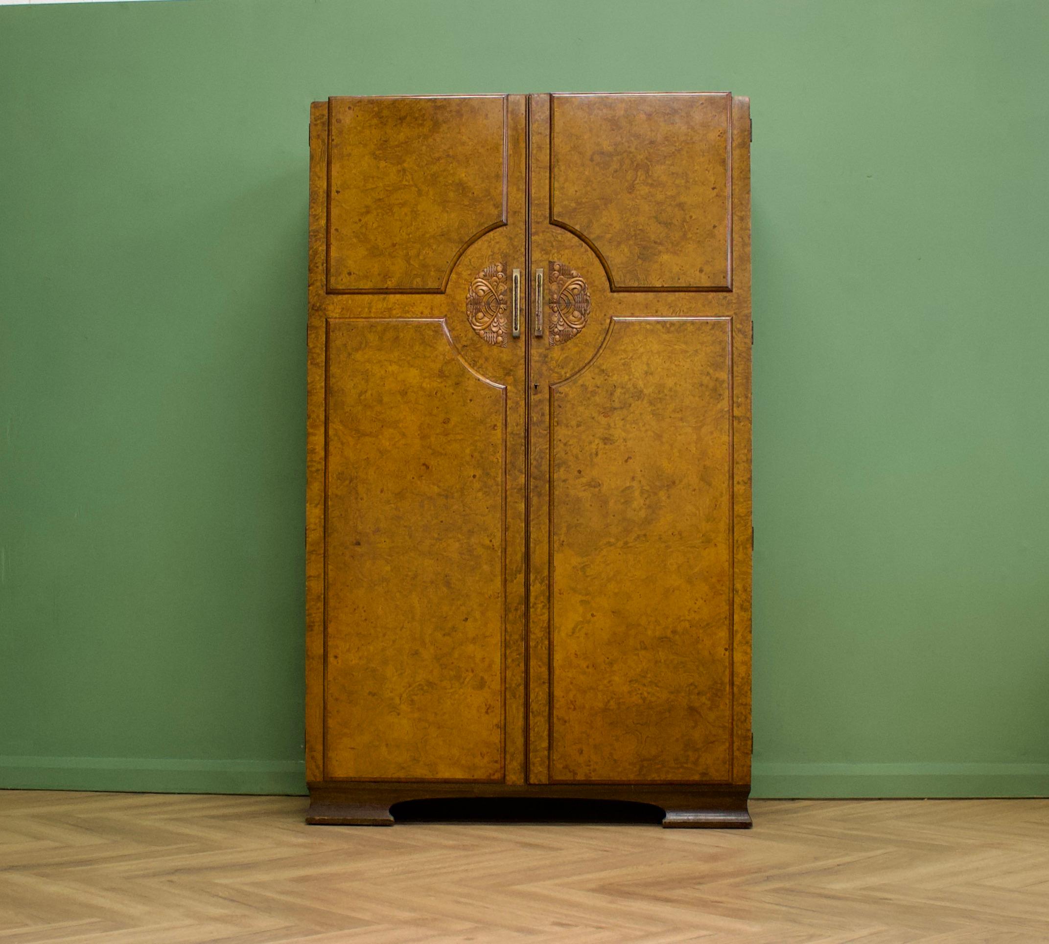 An impressive quality Art Deco style burr walnut triple door wardrobe - perfect for a maximalist interior - dating from the 1950's-1960's
 
The interior is  fitted with a hanging rail and a shelf 
 
This wardrobe separates into 2 pieces 
