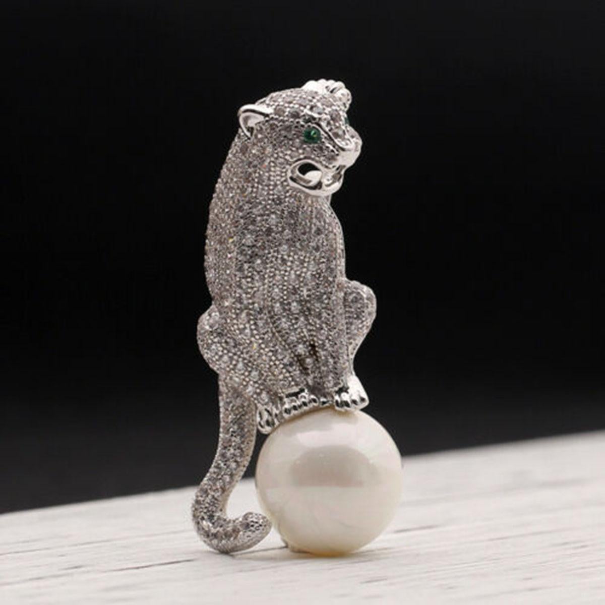 Beautiful, Stylish and finely detailed Jaguar Panther Brooch encrusted with sparkling Faux Diamond Ice Crystal Rhinestones, sitting on a 15mm faux white Pearl. White Gold plated mounting; pin measures  approx. 2'' Inches Tall x 1'' Inch Wide.