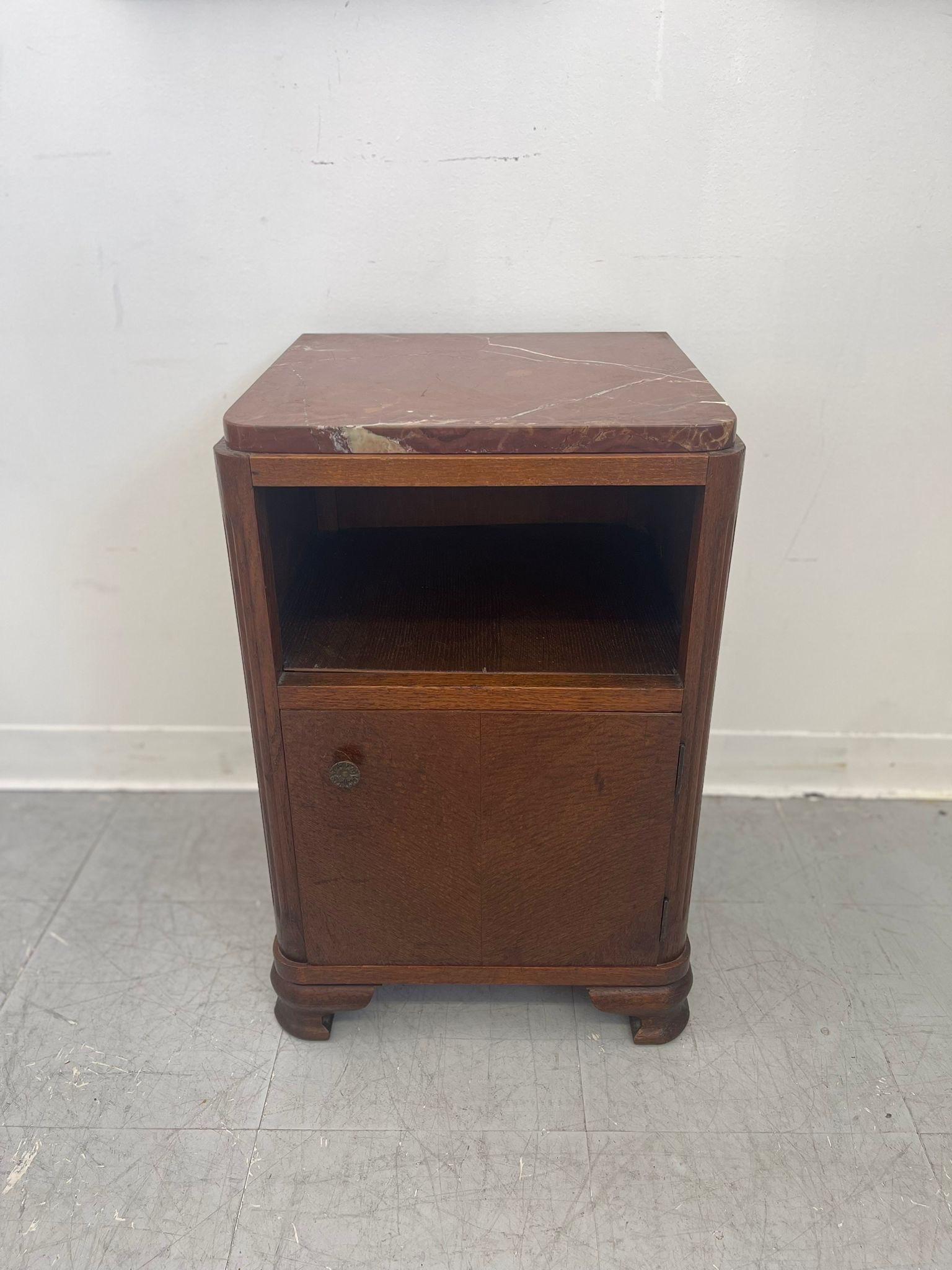 Original hardware to the cabinet door. One open shelf. The marble top is removable. Finished Back. Wood carving details to the corners, interesting shape to the feet. Wood has shaped beautifully. Vintage Condition Consistent with Age as