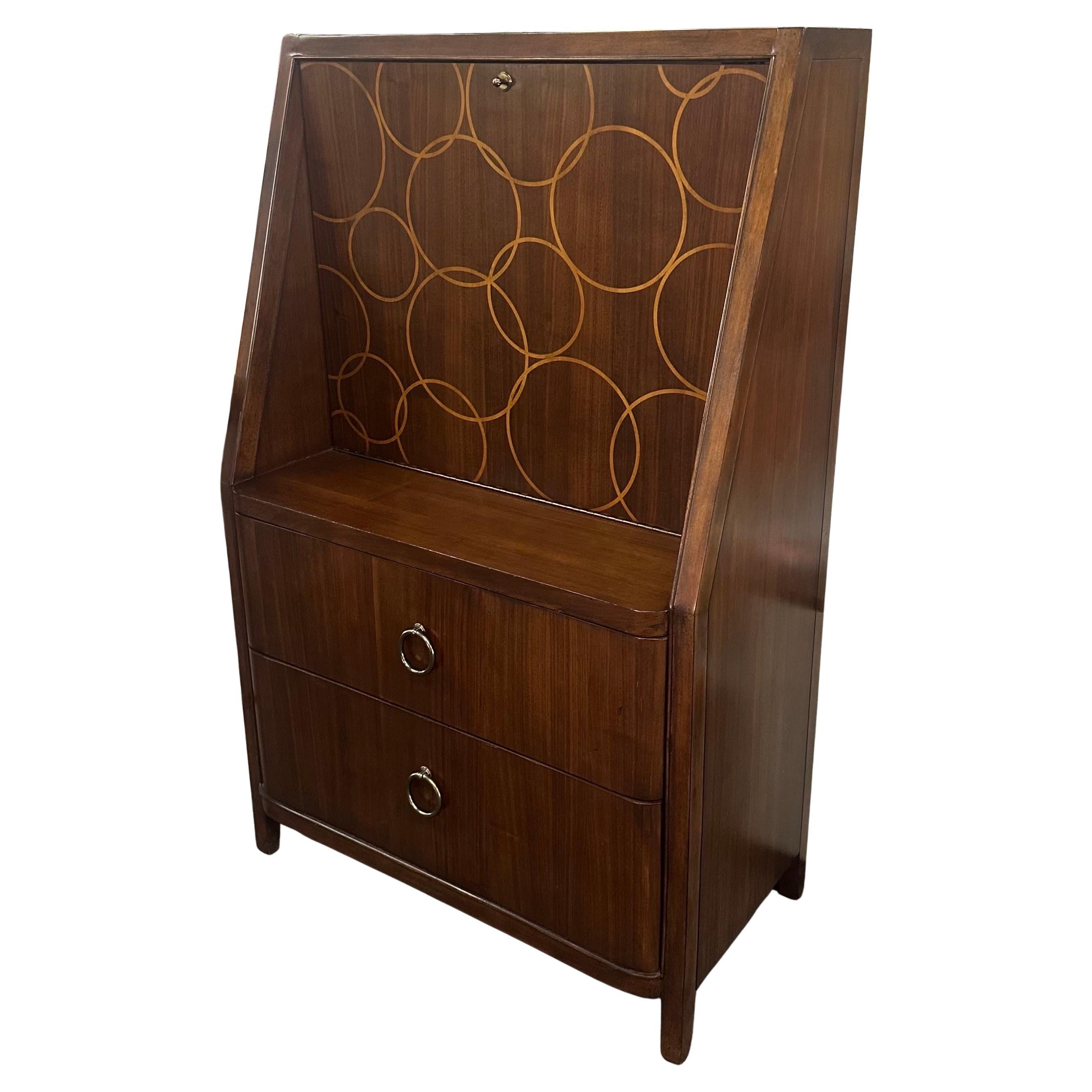 Absolutely gorgeous vintage art deco style inlaid drop front bar cabinet by Drexel Heritage, circa 1980s.  Very rare to find and in remarkable original vintage condition. Incredible inlaid front with circle pattern, drops down to form a bar table