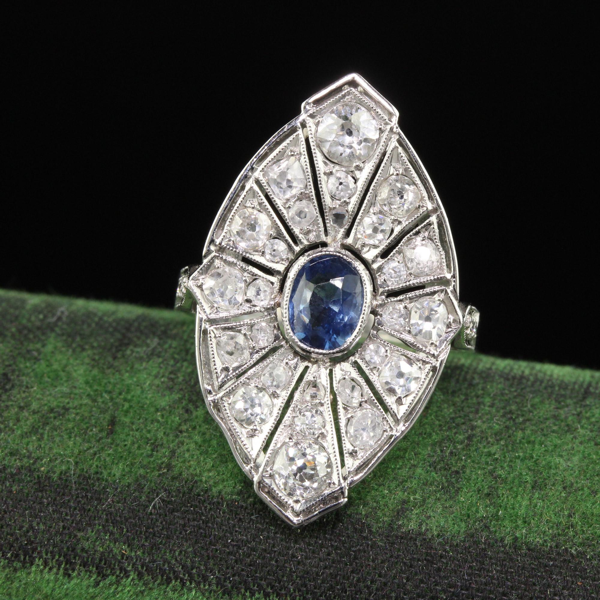 Beautiful Vintage Art Deco Style Platinum Old Mine Diamond and Sapphire Cocktail Ring. This gorgeous cocktail ring is beautifully crafted to the specifications of how jewelry was made in the 1930s. It holds beautiful old mine cut diamonds and a