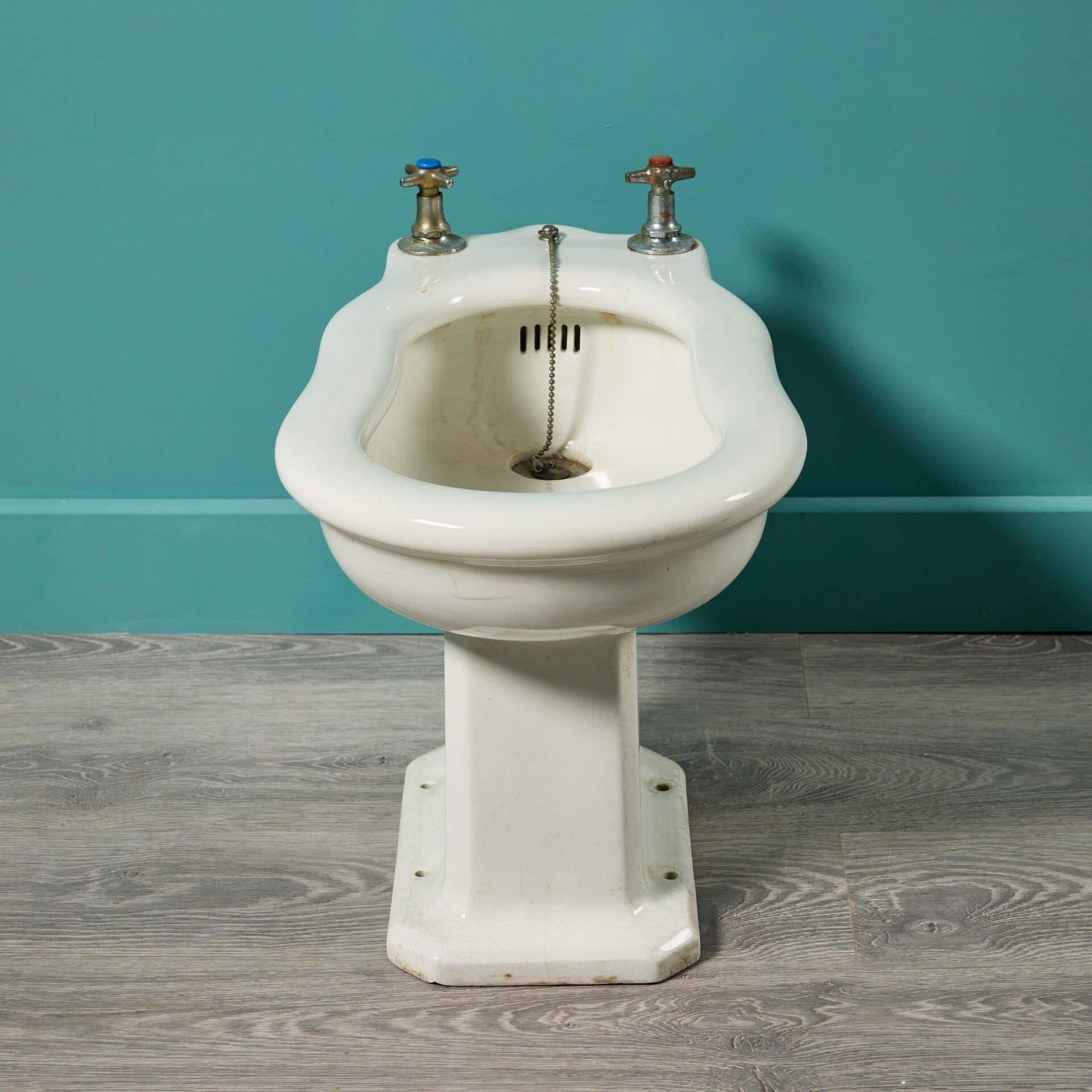 A vintage art deco style porcelain bidet made by De Sphinx. This early 20th century piece has an even crazed vintage look, which would make for a stylish addition to a bathroom in a contemporary or period property.

De Sphinx

De Sphinx, more