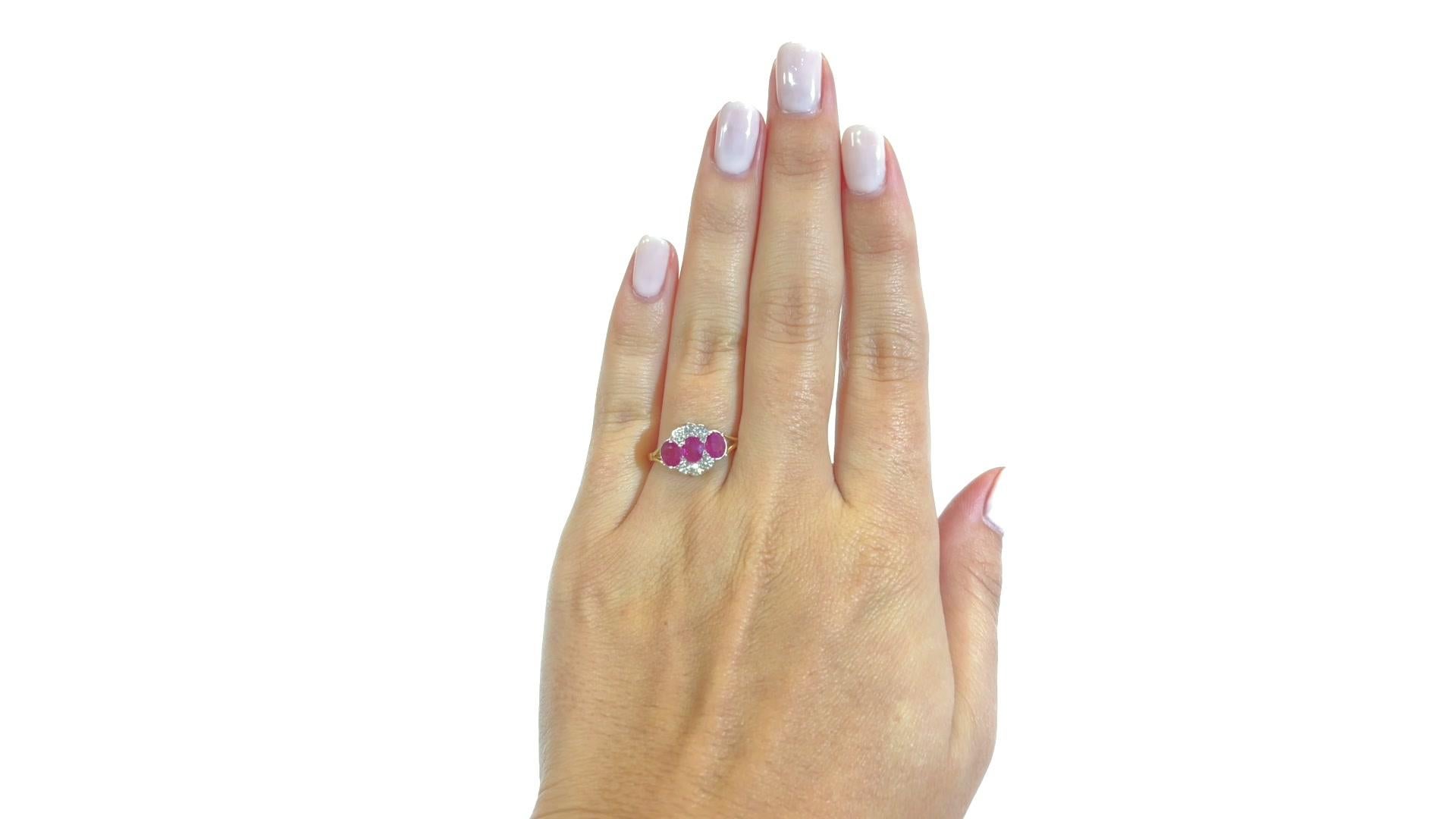 The vibrant color of these rubies immediately makes you fall in love with this Vintage Art Deco Style Ruby Diamond 18k Gold Ring. Geometrically pleasing, lively and colorful. 

This one of a kind ring features 3 oval rubies approximately 1.20 carat.