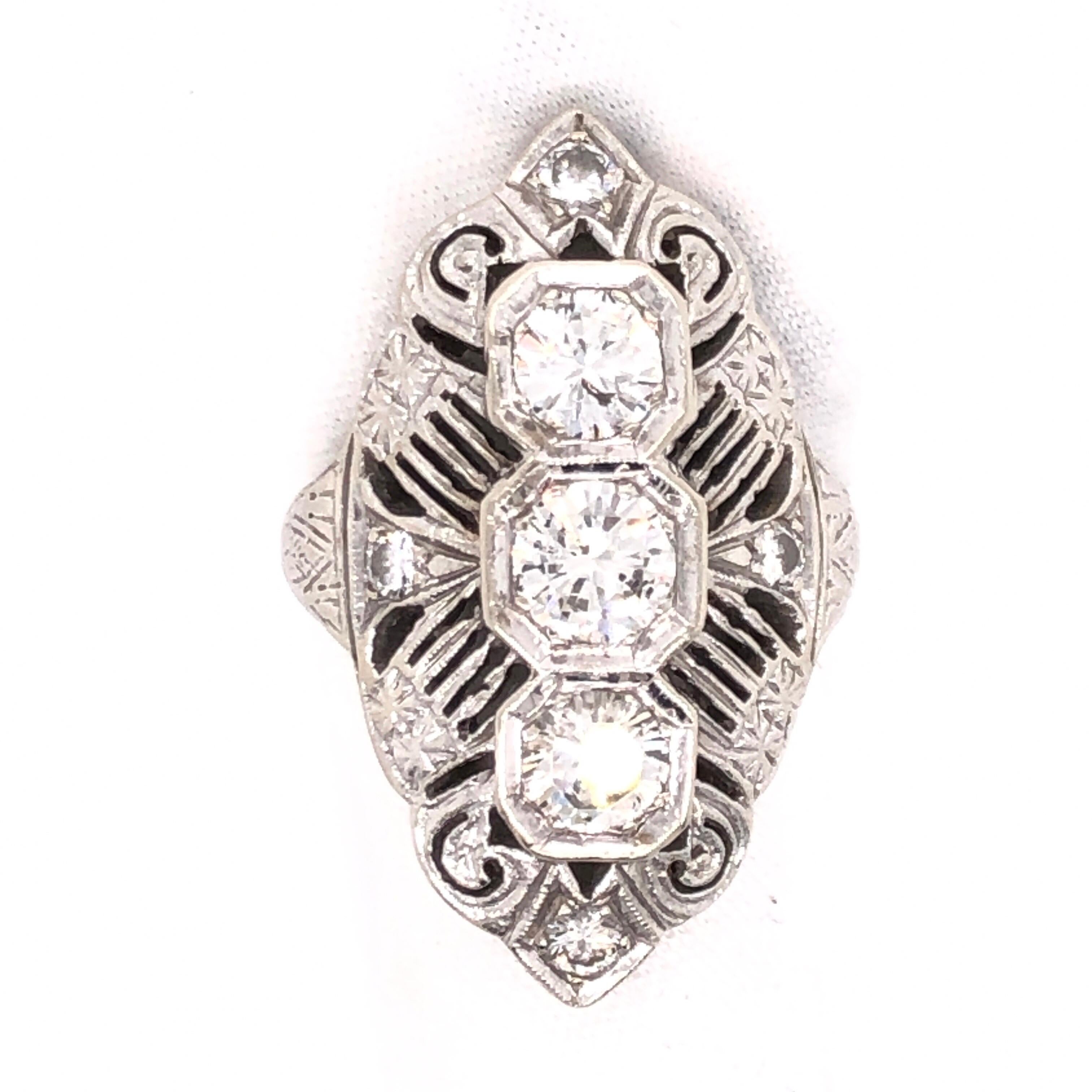 Bring in the 20's (yes it is this coming New Years!) with this circa 1920's Vintage Art Deco style diamond ring. The unique design features 3 center diamonds with 4 accent diamonds (estimated total carat weight of 1.4 CT).

Stamped: 14K

Size:6