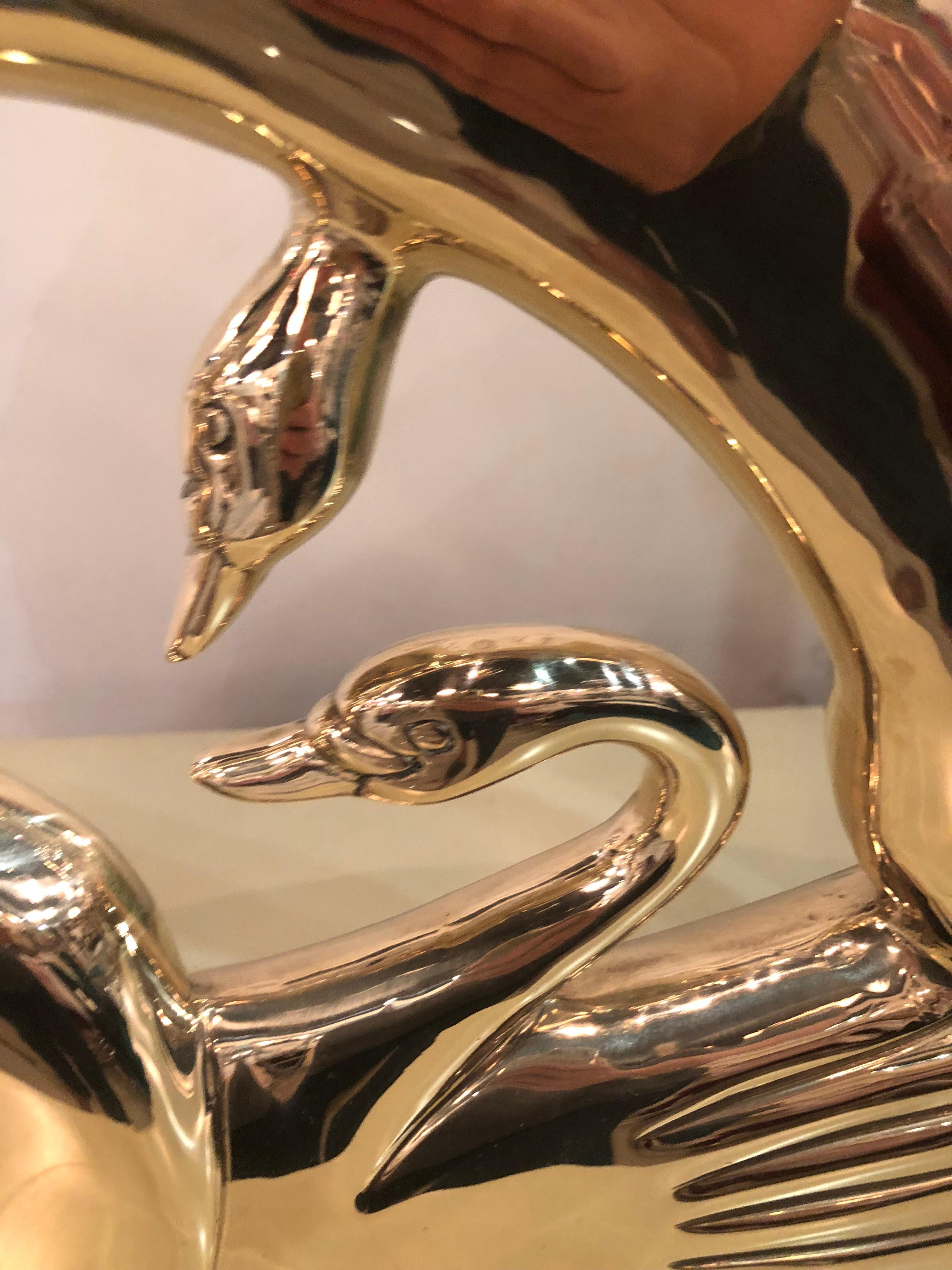 Lovely vintage Art Deco double swan polished brass statue. Professionally polished. Small indent on back (pictured).