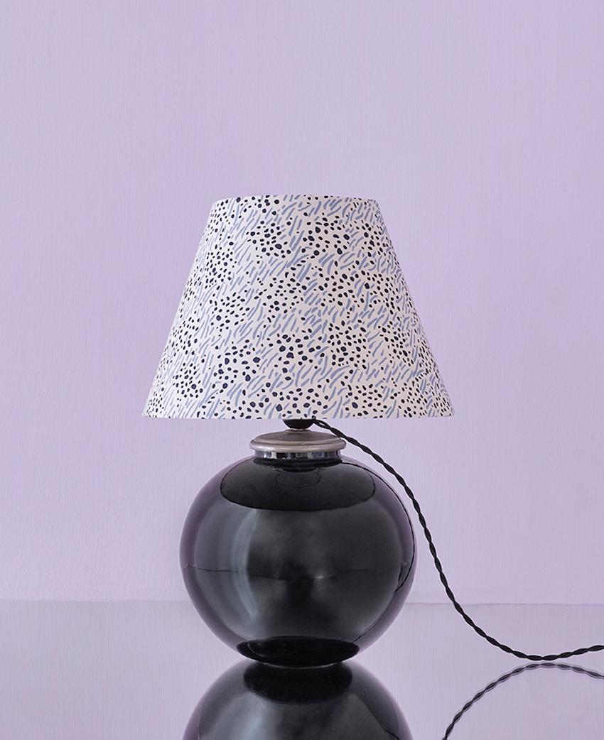France, 1930's

Art Deco table lamp in black opaline glass with customised shade

Measures: H 47 x W 32 cm.