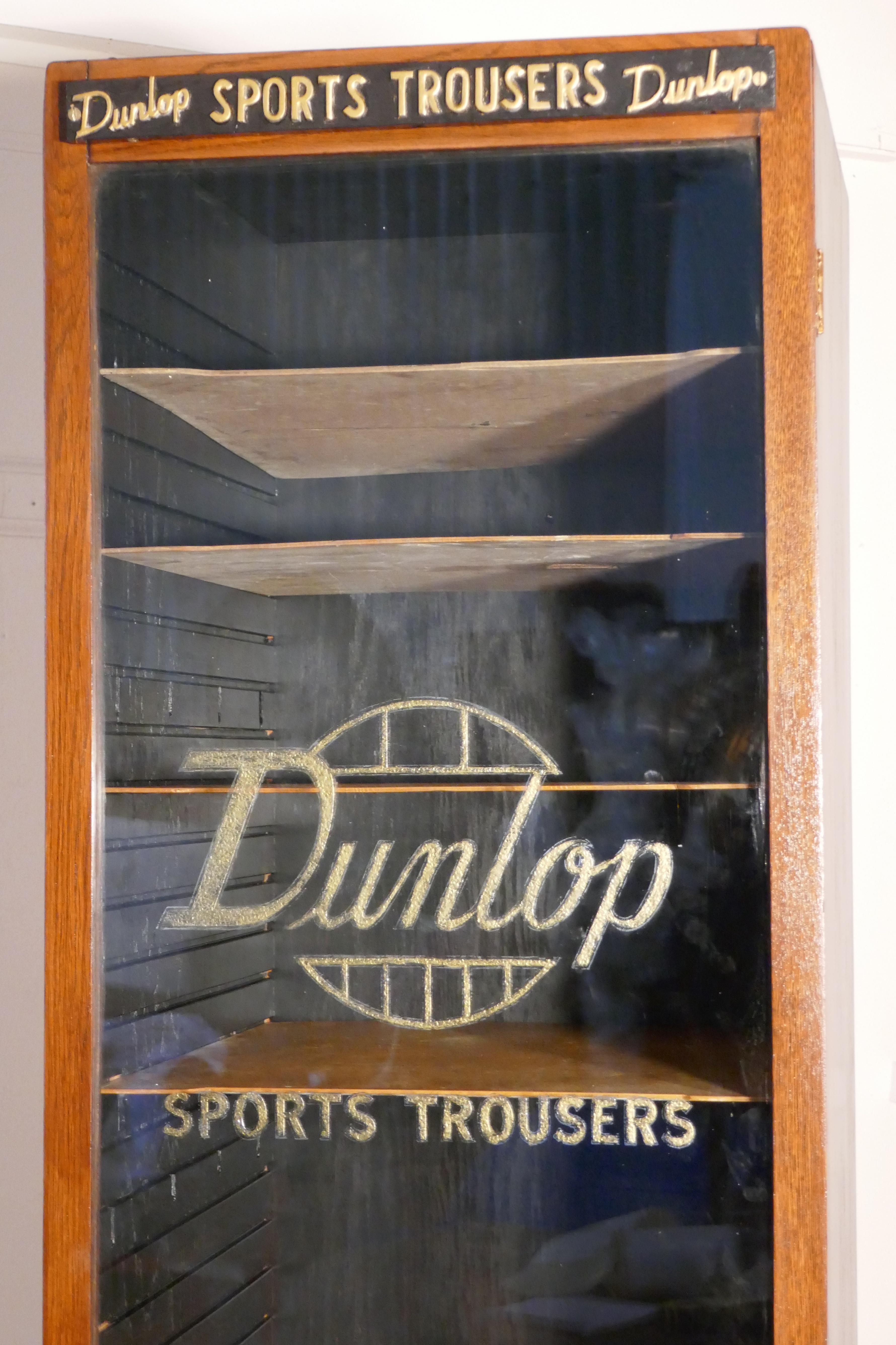 Vintage Art Deco tall Haberdashery Dunlop sports cabinet, 

This tall and multi shelf cabinet it has a glass fronted door, the cabinet was made to store Dunlop sports trousers, the 9 shelves can be rearranged according to requirements, the