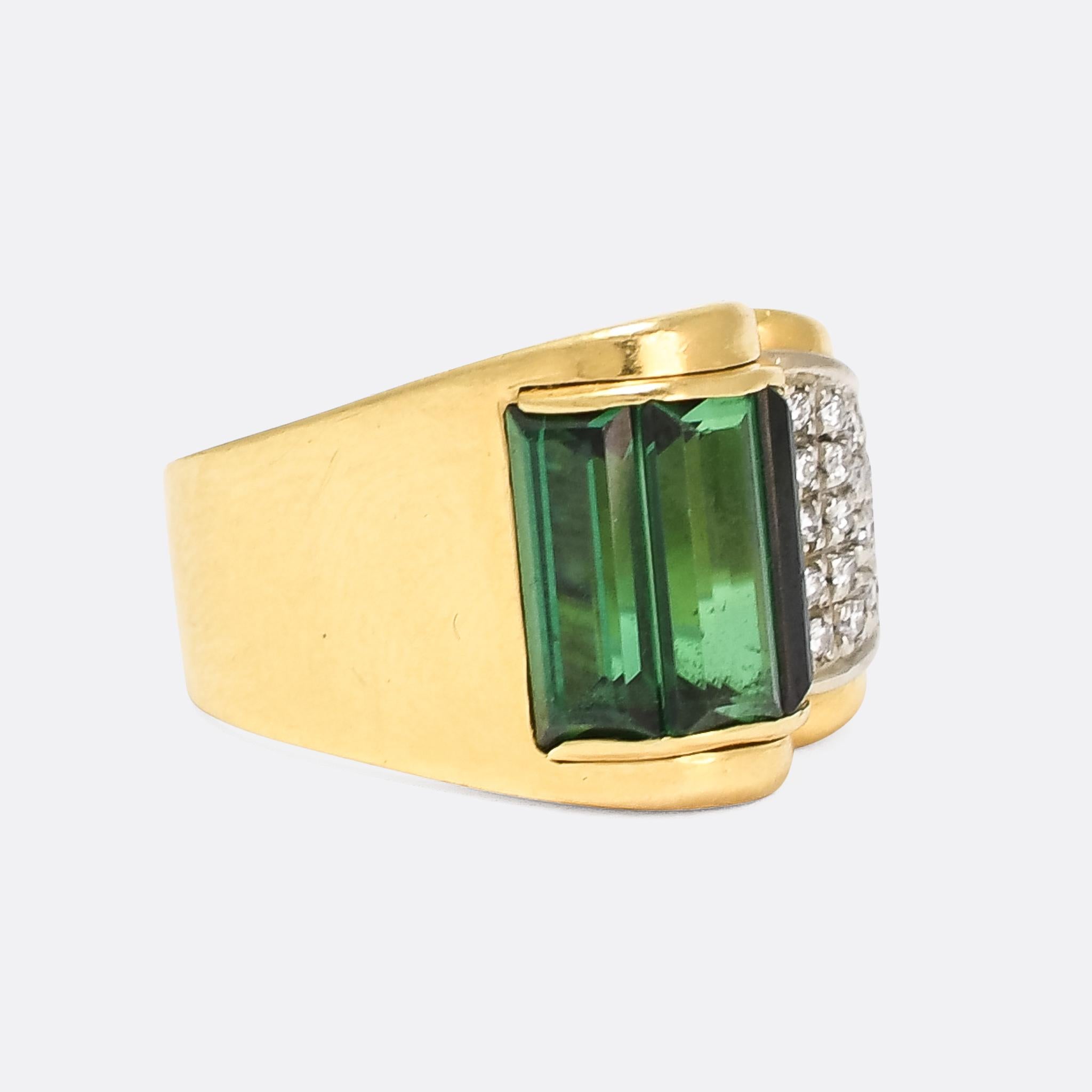 A stunning Art Deco cocktail ring set with green tourmaline and diamonds. The three long tourmaline baguettes are set in a semicircular bezel that curves around to meet the pavé diamond section - quintessentially Deco in design and bold use of