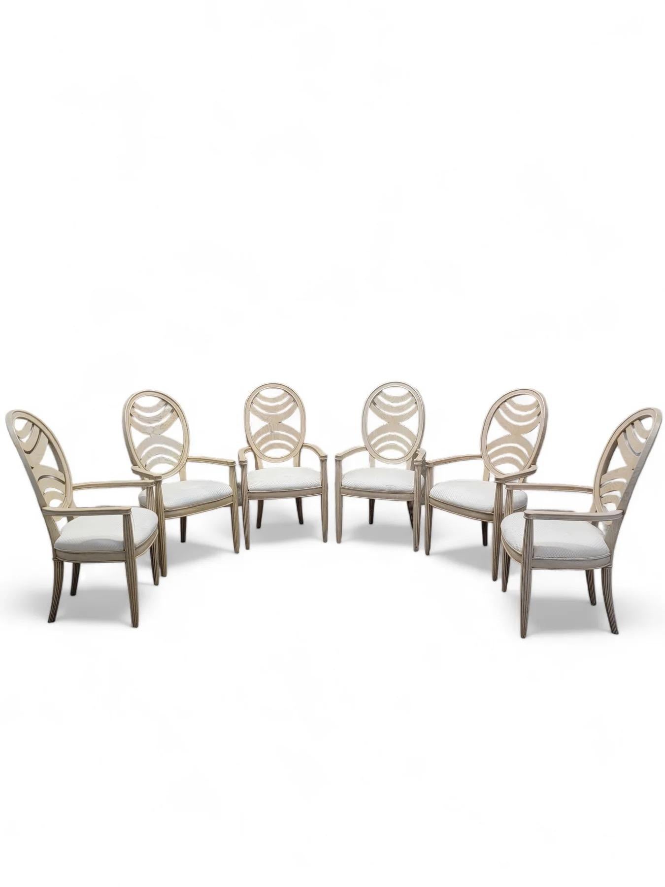 Vintage Art Deco Transitional Henredon Pickled Oak Omni Collection Dining Set - Set of 7

This set includes a large oval table with a pedestal base and six chairs. The chairs have been painted white and have an oval seat back with wood slat