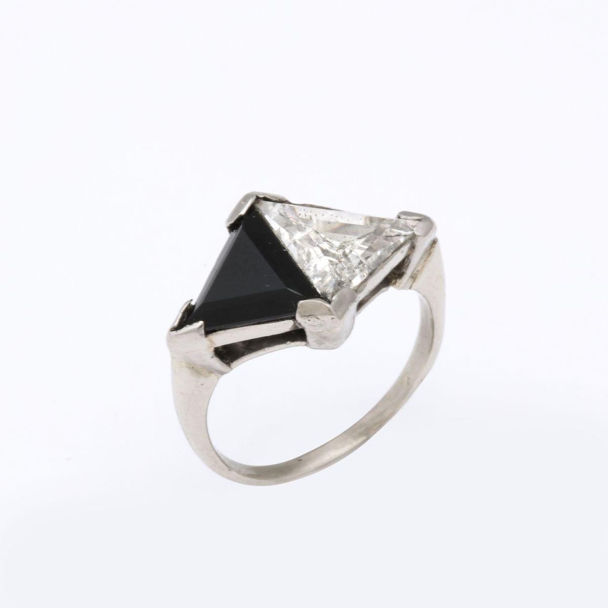 A stunning rare Art Deco Design triangular diamond and onyx vintage ring set in a classic original platinum band. Diamond This is a rare cut and exceptional size to find in a vintage ring and black and white is most desirable c 1940

