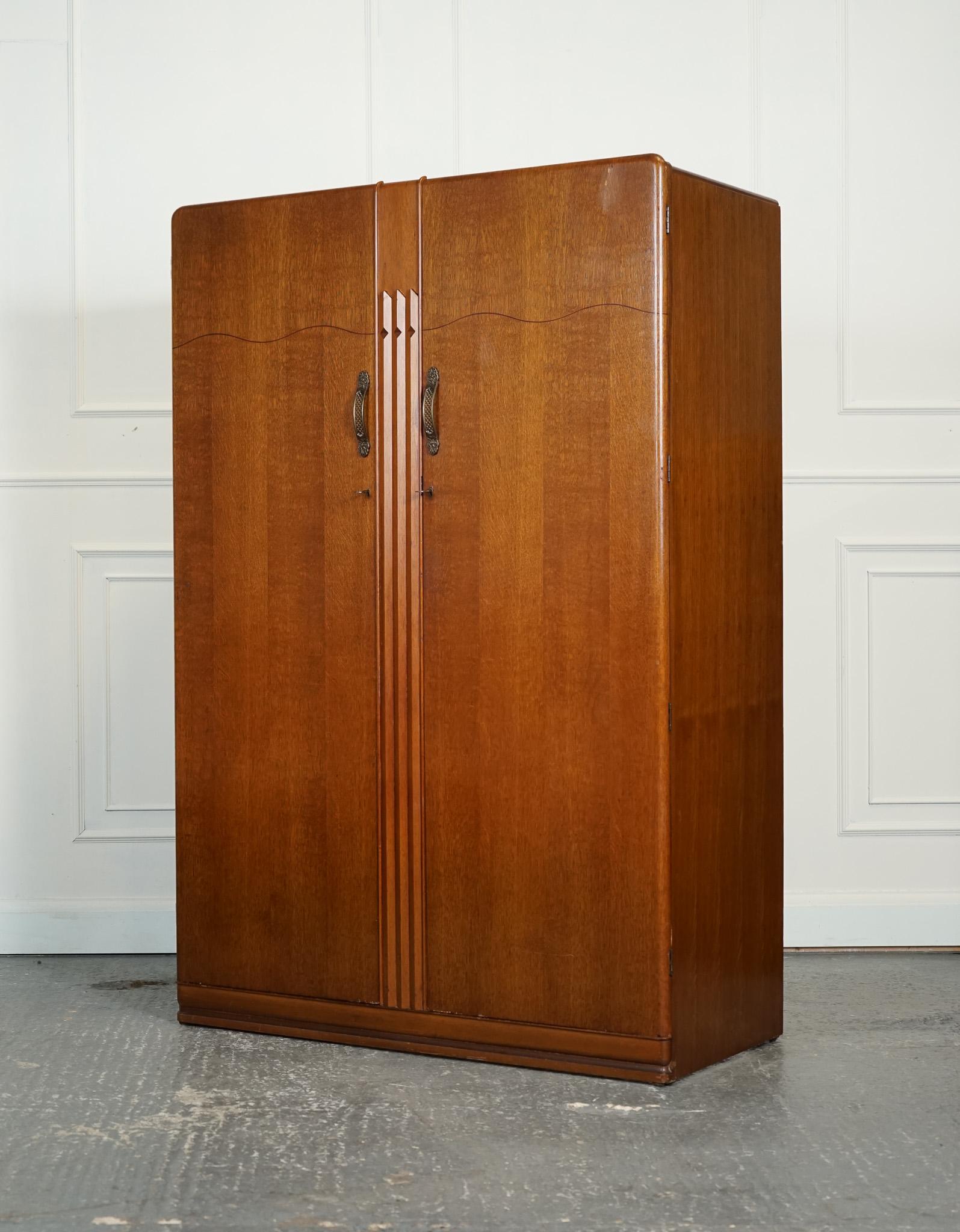 
We are delighted to offer for sale this Lovely Vintage Art Deco Style Wardrobe.

The vintage Art Deco two door wardrobe by Lebus Furniture is a stylish and functional piece of furniture that exudes elegance. Made from high-qualitywood, it features
