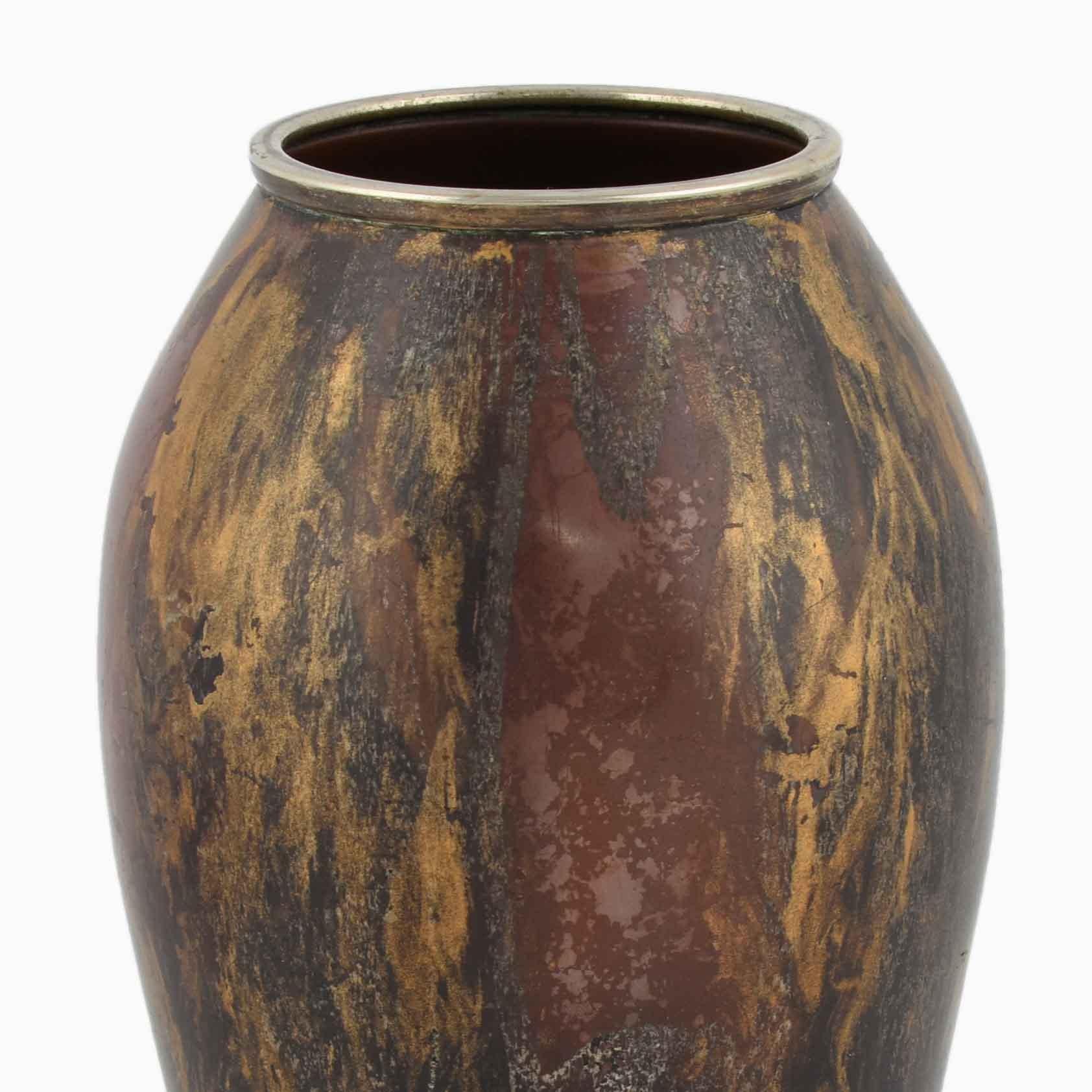 Vintage Art Deco vase is a beautiful and rare original decorative object realized between the 1920s and the 1930s, in a limited numbered edition. 

Original copper carved with sponging decoration in silver and gold. 

Realized probably by