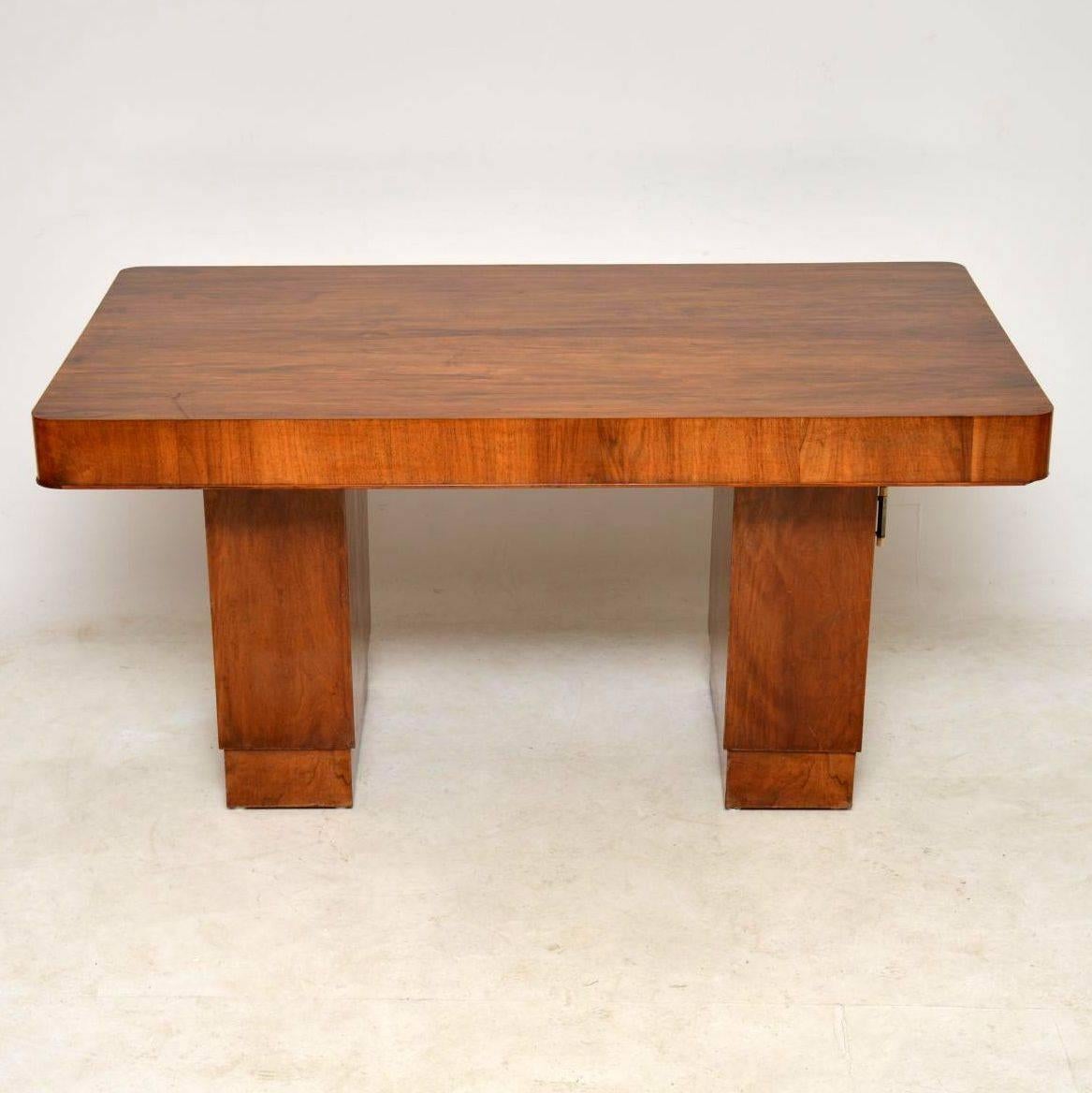 A beautiful original Art Deco vintage dining table in walnut, this dates from around the 1920s-1930s. The condition is excellent for its age; there is just some extremely minor wear here and there. This has a lovely polished finish; there is just