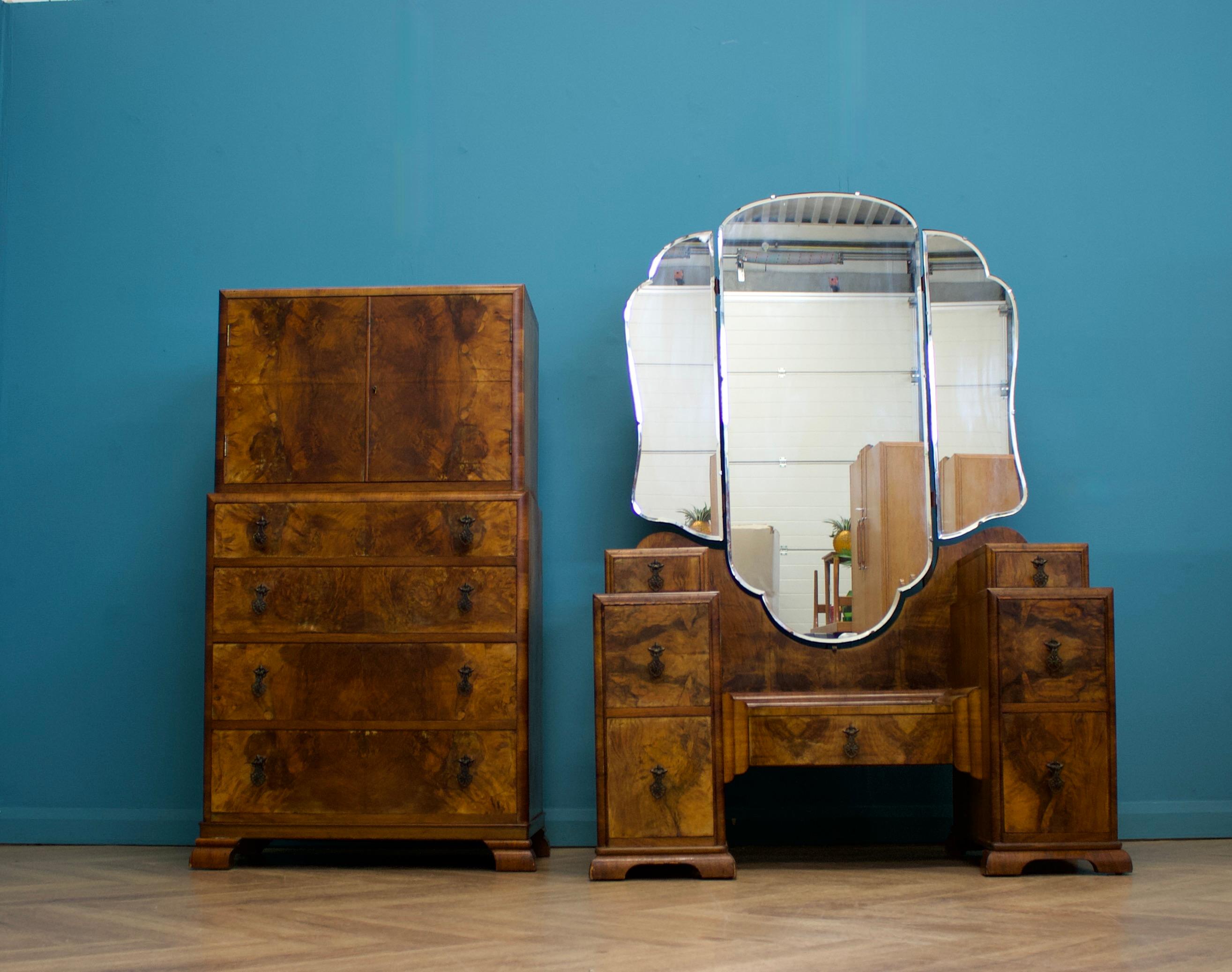 An impressive quality Art Deco burr walnut tallboy or housekeeper’s cupboard, circa 1930s

There's a cupboard to the top and four drawers to the bottom

The original key is present and the lock works - the handles are made from metal

There's a