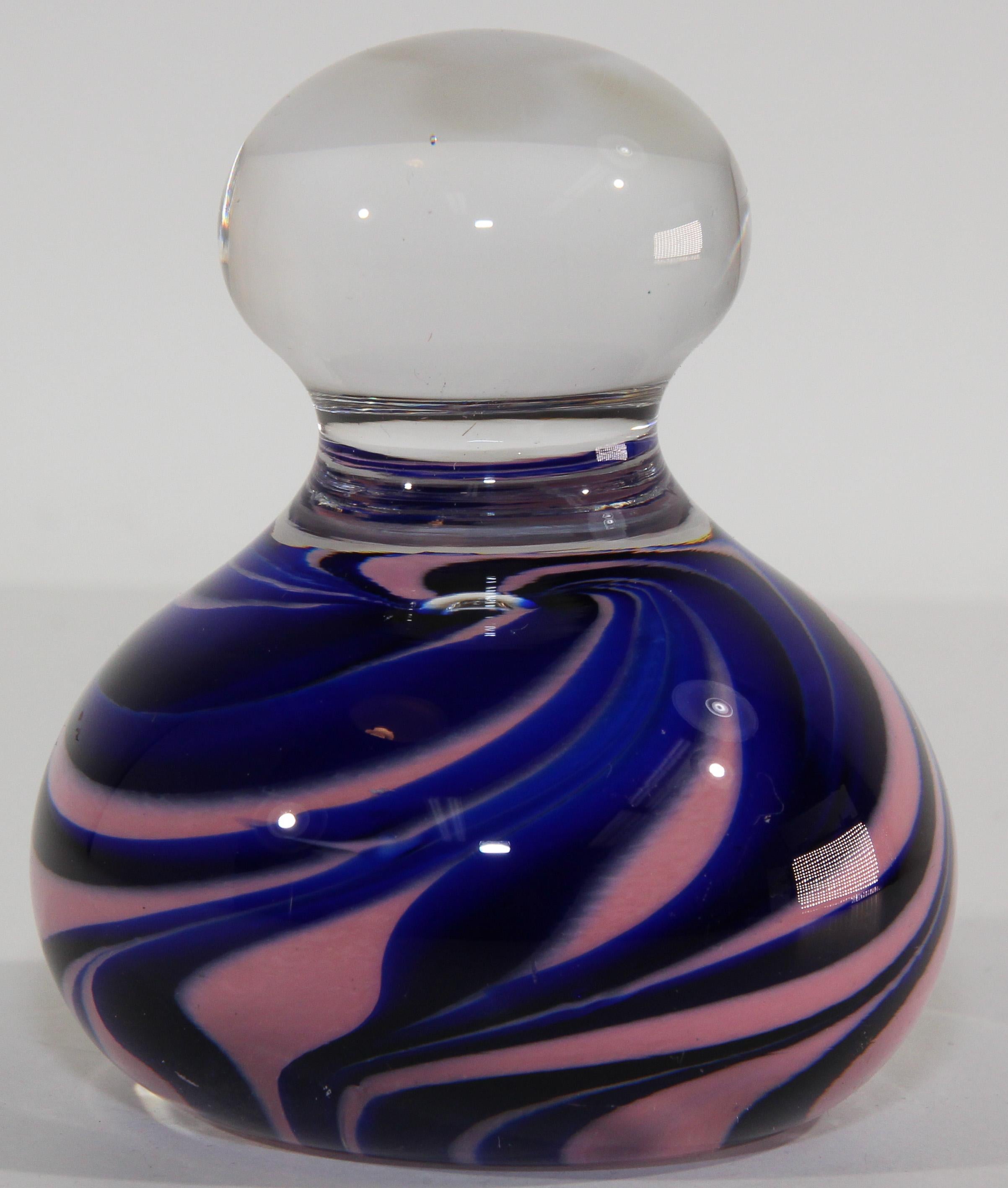 Handcrafted Gorgeous Vintage Art Glass abstract design paperweight.
Beautiful paperweight pink and blue swirl modern art design.
Colors are a cobalt blue, pink and transparent clear.
Signed, dated 2001.
Hand made in Gibraltar.
Diameter 2.75