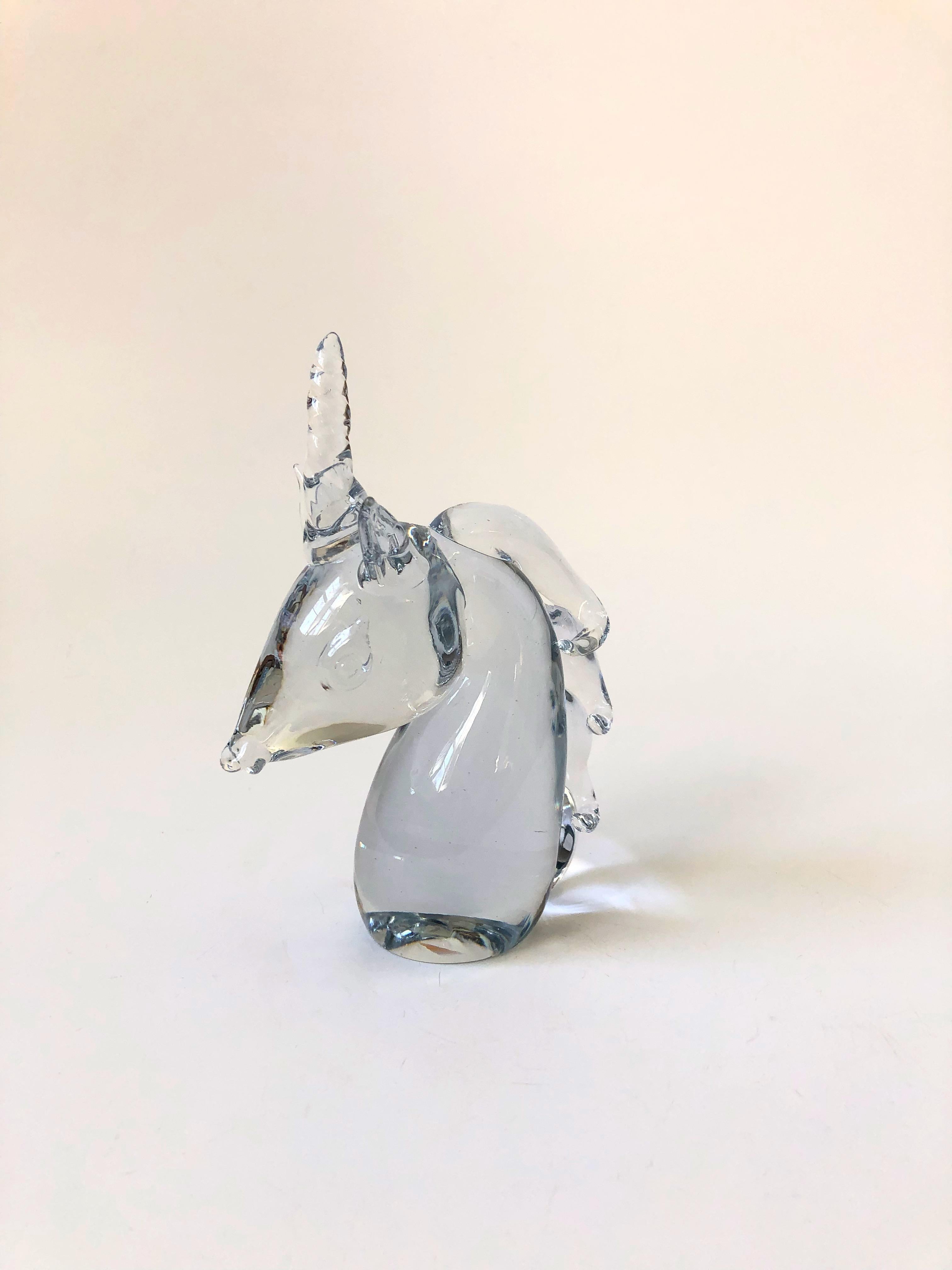 A sweet vintage blown art glass unicorn head. A great small decorative item or paperweight. Made in Taiwan for Great City Traders of San Francisco.
   
