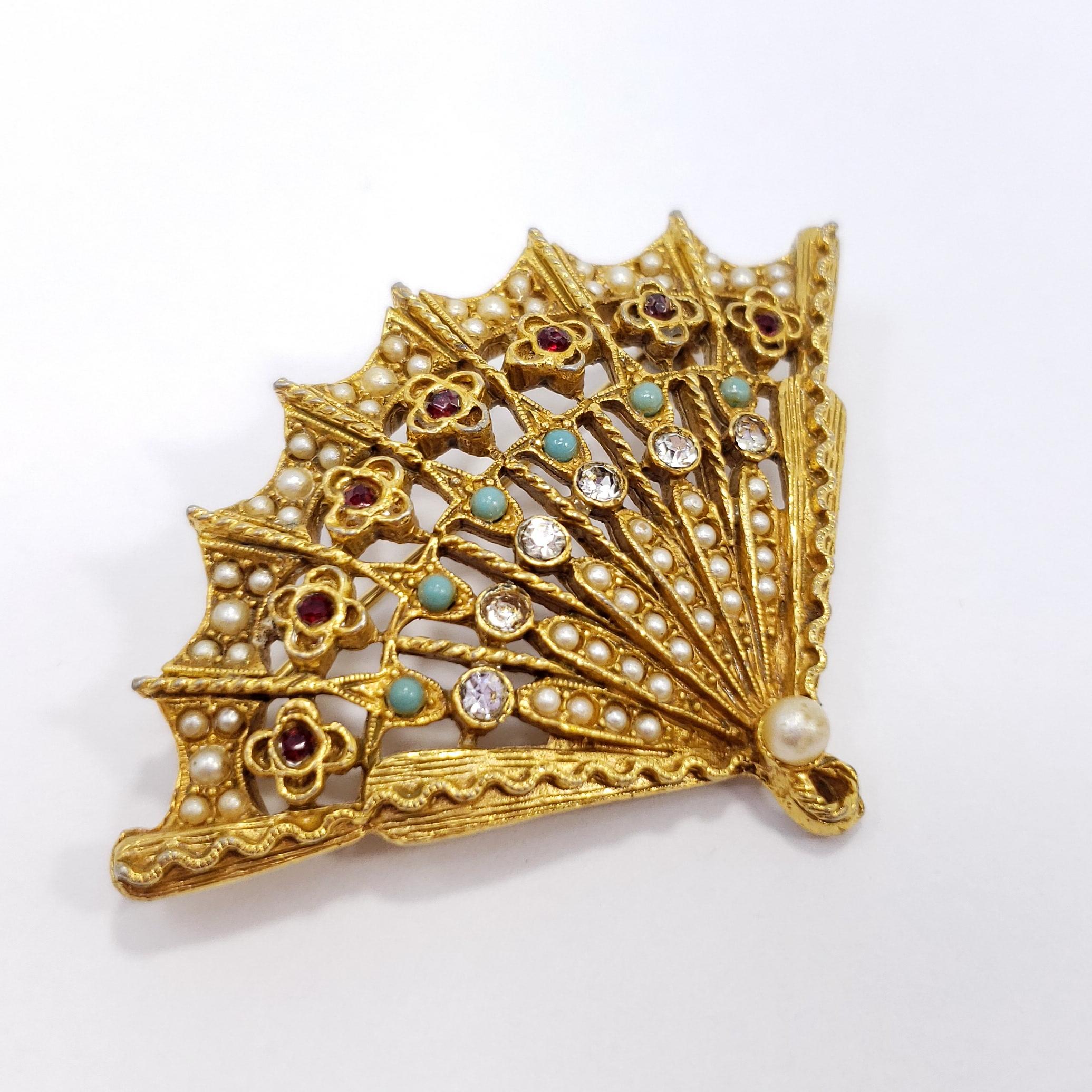 Stylish folding fan pin-brooch, decorated with faux pearls, jade beads, and crystals. By Arthur Pepper (ART). 

Marks / hallmarks / etc: ART