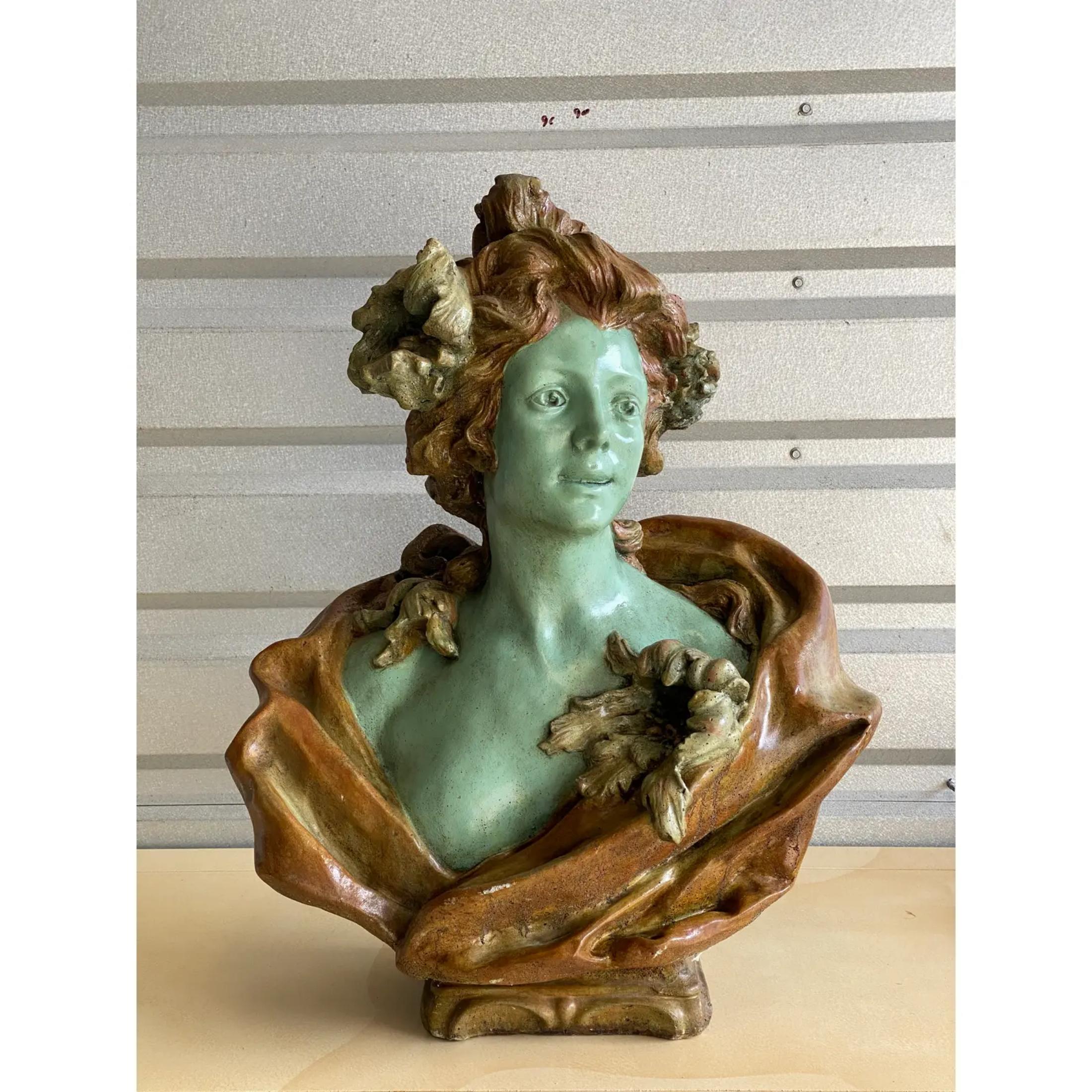 Amazing vintage Art Nouveau female bust. Stunning depiction of a female surrounded by flowers. Intriguing green skin tone. Acquired from a Palm Beach estate