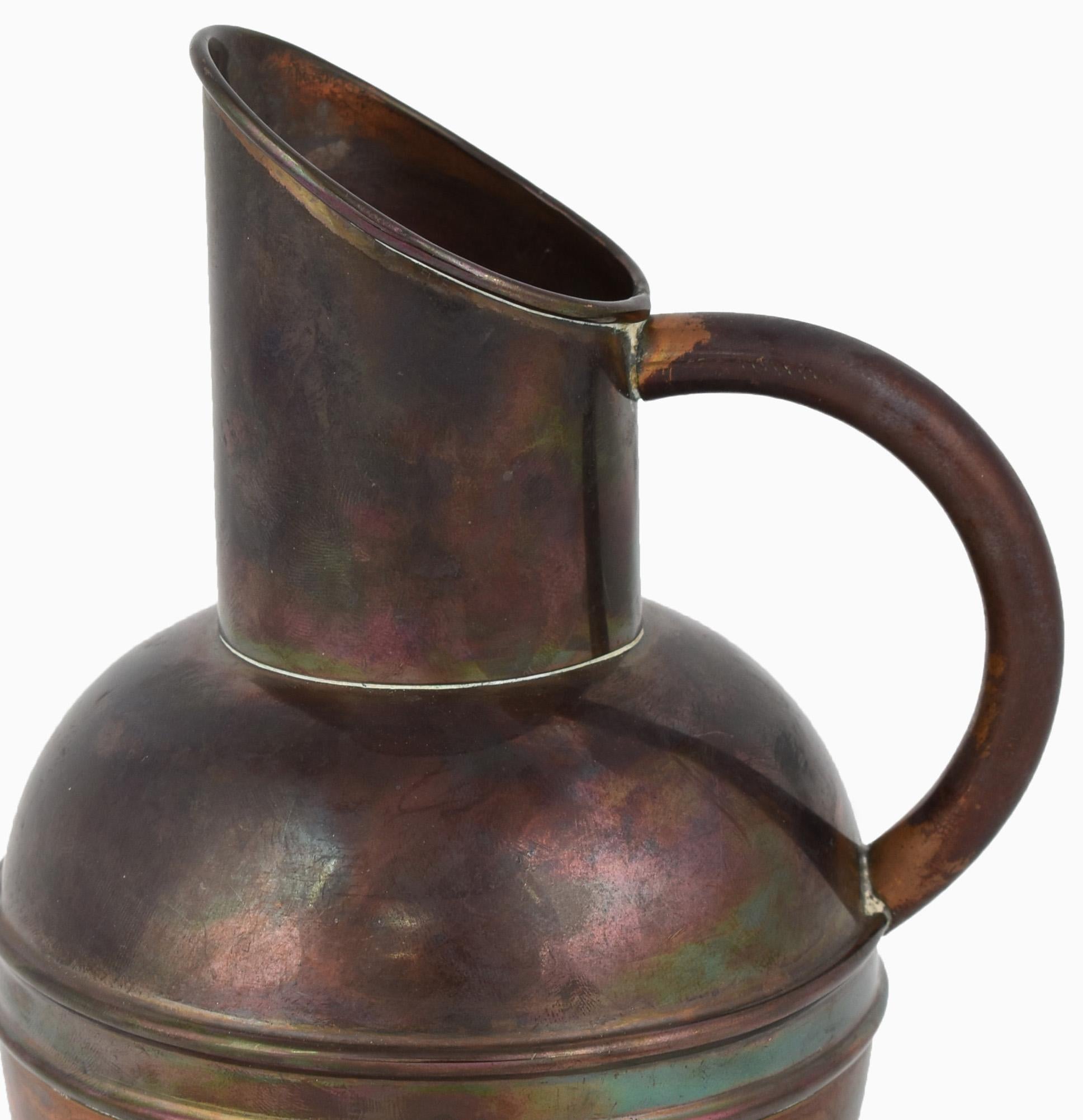 Copper jug is an original decorative object realized in the first years of the 20th century. 

Original copper. 

Realized by Henry Loveridge & Co., Wolverhampton. Made in England. 

Very good conditions. 

Beautiful burning copper metal jug