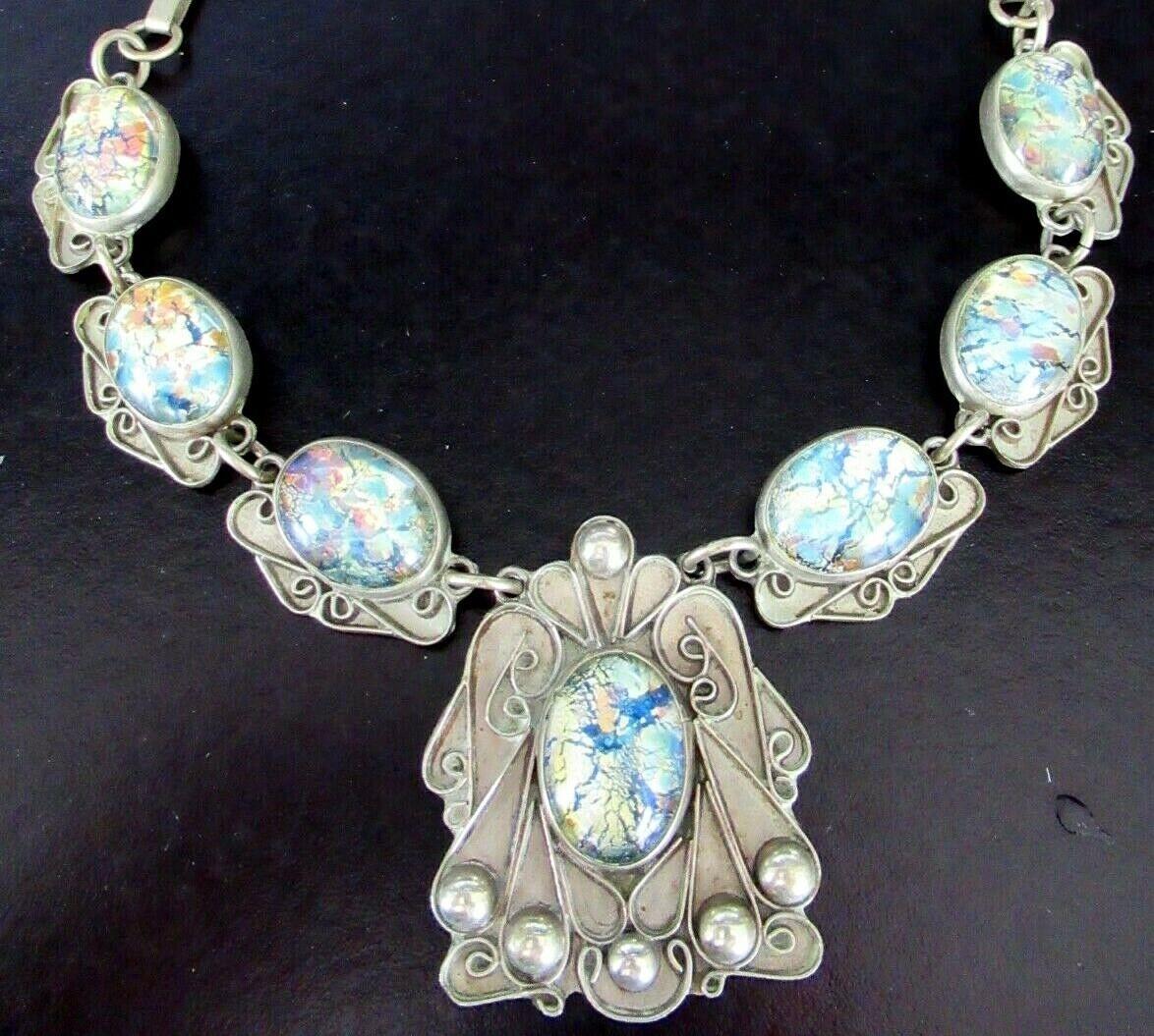 Antique Art Nouveau Necklace set with 7 Foil set vibrant Opal Cabochons. Hand crafted in Sterling Silver. The Silver work is exceptional, very typical of the Art Nouveau style. Approx.  22.5