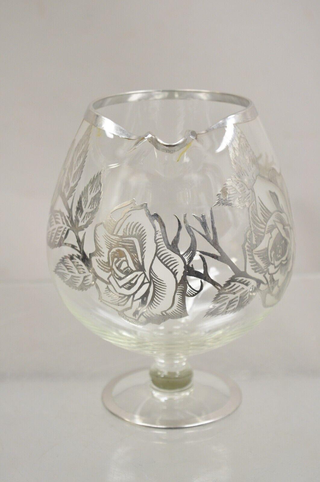 Vintage Cambridge Art Nouveau Floral Sterling Silver Overlay Glass Footed Water Pitcher. Item features blown glass base, sterling silver overlay, very nice vintage pitcher. Circa Early to Mid 20th Century. Measurements: 7.5