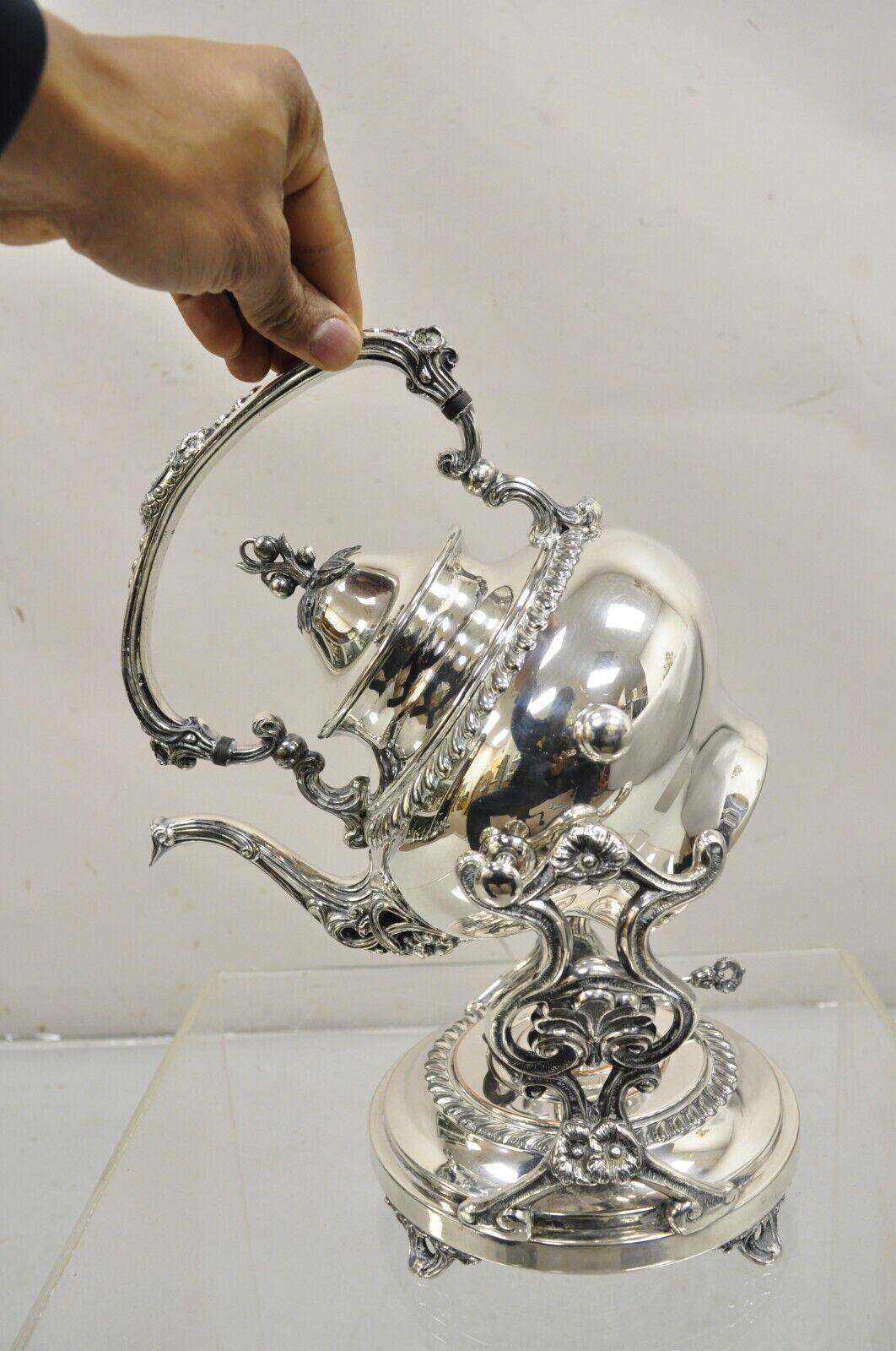 Vintage Art Nouveau Silver Plated Floral Repousse Tilting Tea Pot on Stand In Good Condition For Sale In Philadelphia, PA
