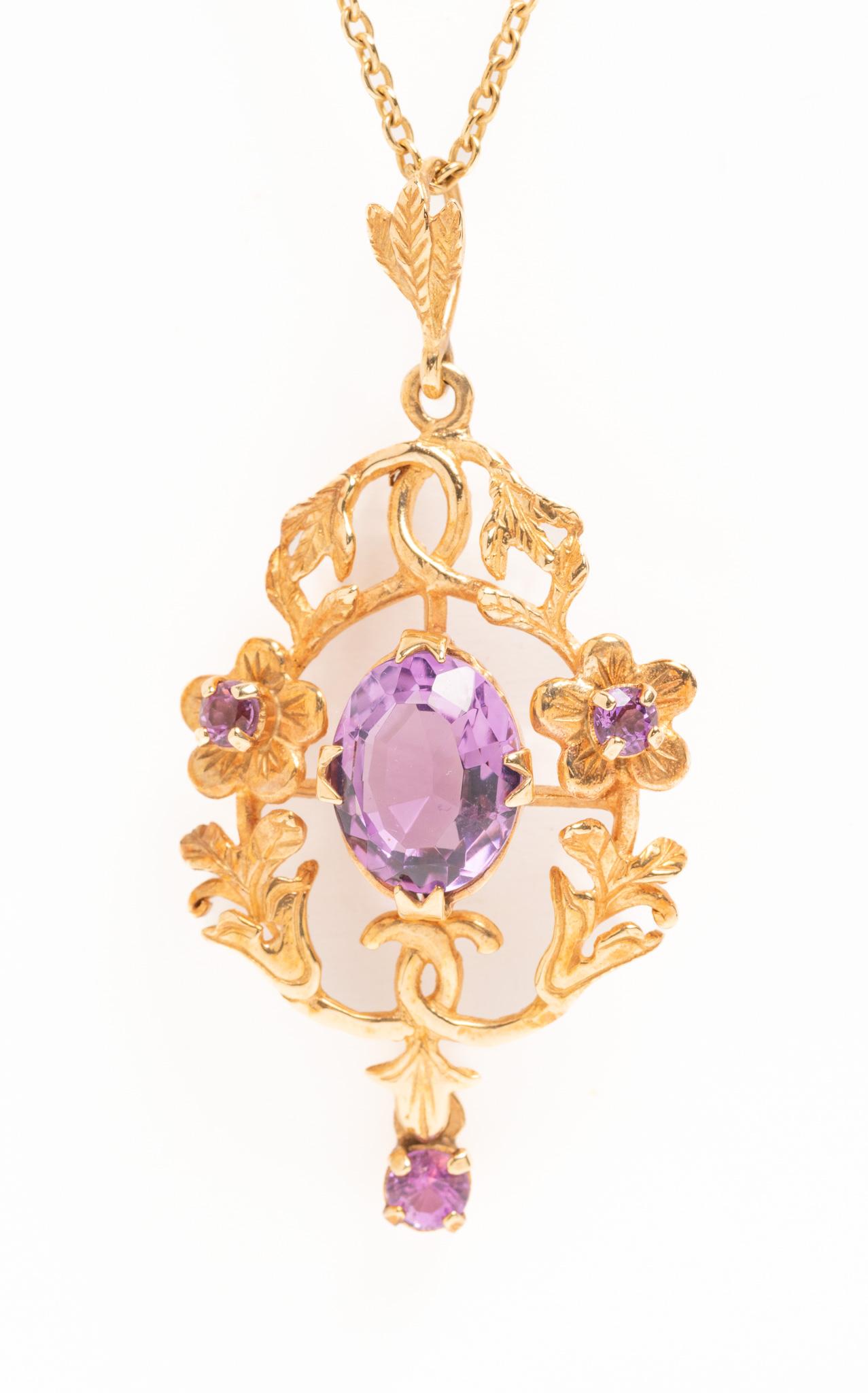 A wonderful vintage Victorian Art Nouveau Style 9ct gold foliate pendant necklace set with amethyst with a lavalier drop. This exquisite pendant has a very large central amethyst measuring 12mm x 8.6mm surrounded by a beautiful gold floral garland