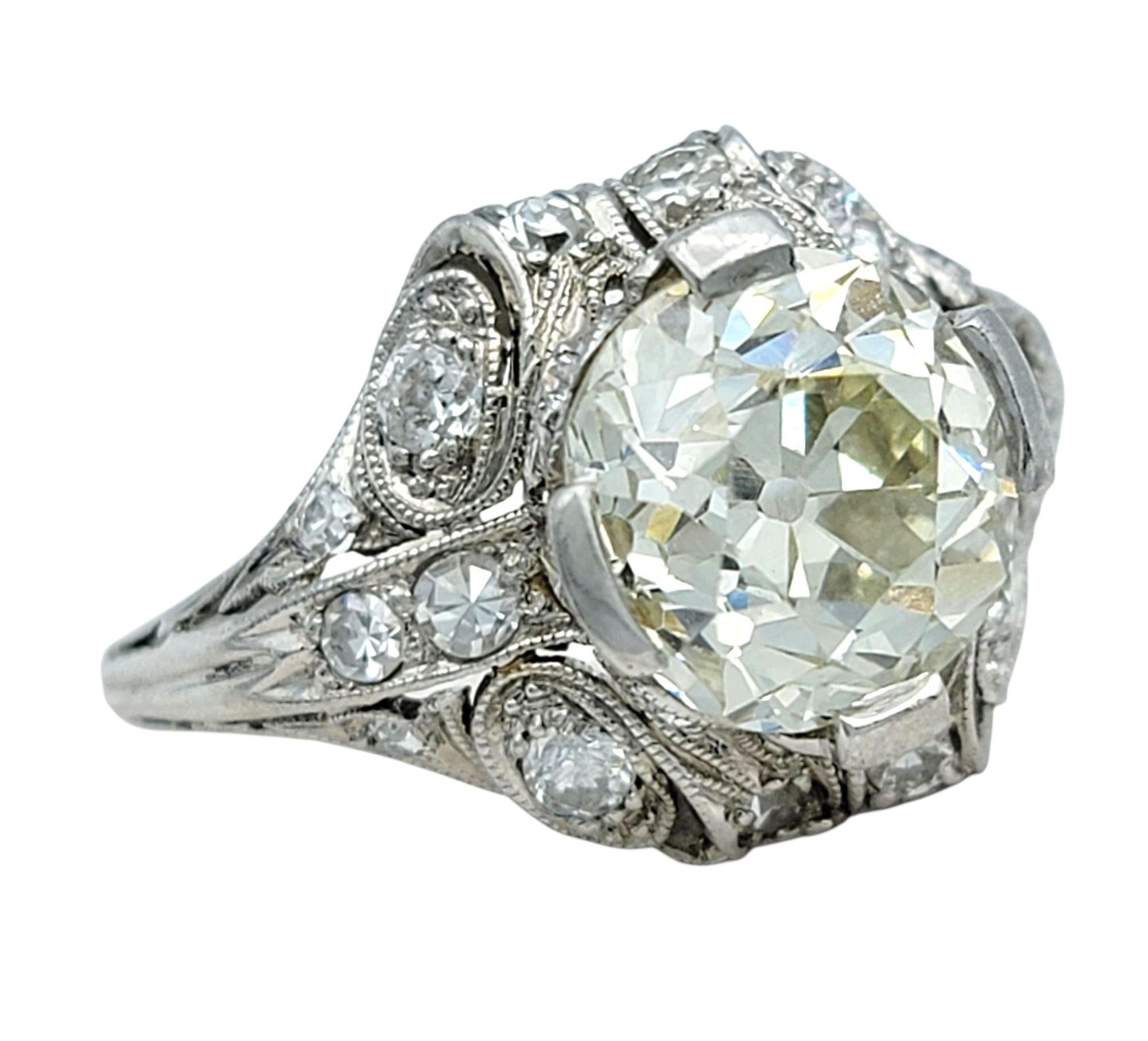 Step into timeless elegance with this enchanting Art Nouveau-style ring, handcrafted in platinum. At its center is a captivating old 2.42 carat European cut diamond, surrounded by intricately detailed openwork that adds softness and romance to the