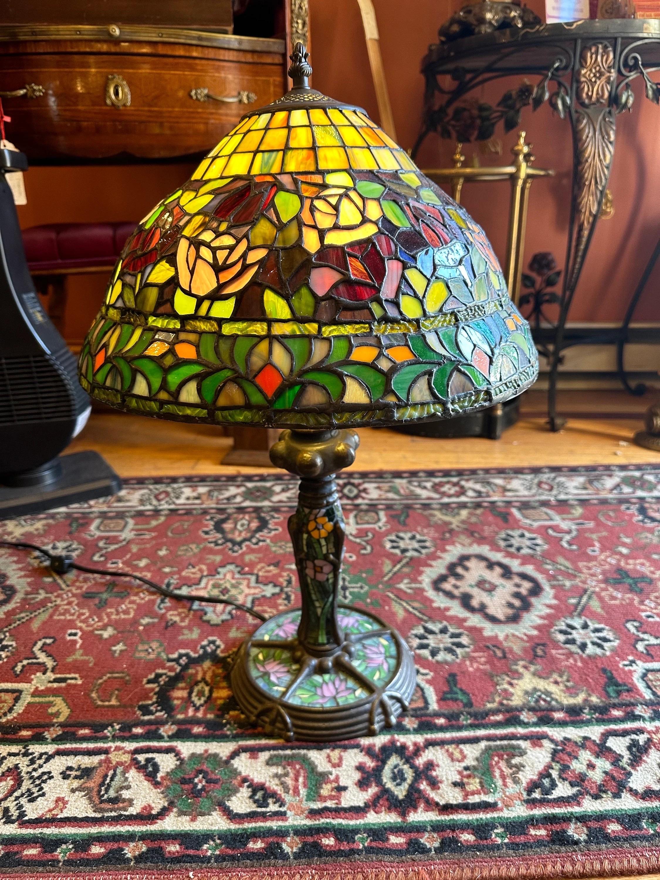 Vintage Art Nouveau Tiffany Style Stained Glass Table Parlor Lamp

Dress up your home with this colorful vintage Art Nouveau Tiffany style stained glass parlor lamp.

Item does not have maker's label.

Circa: 20th Century 

Dimensions:
H: 23”
H: