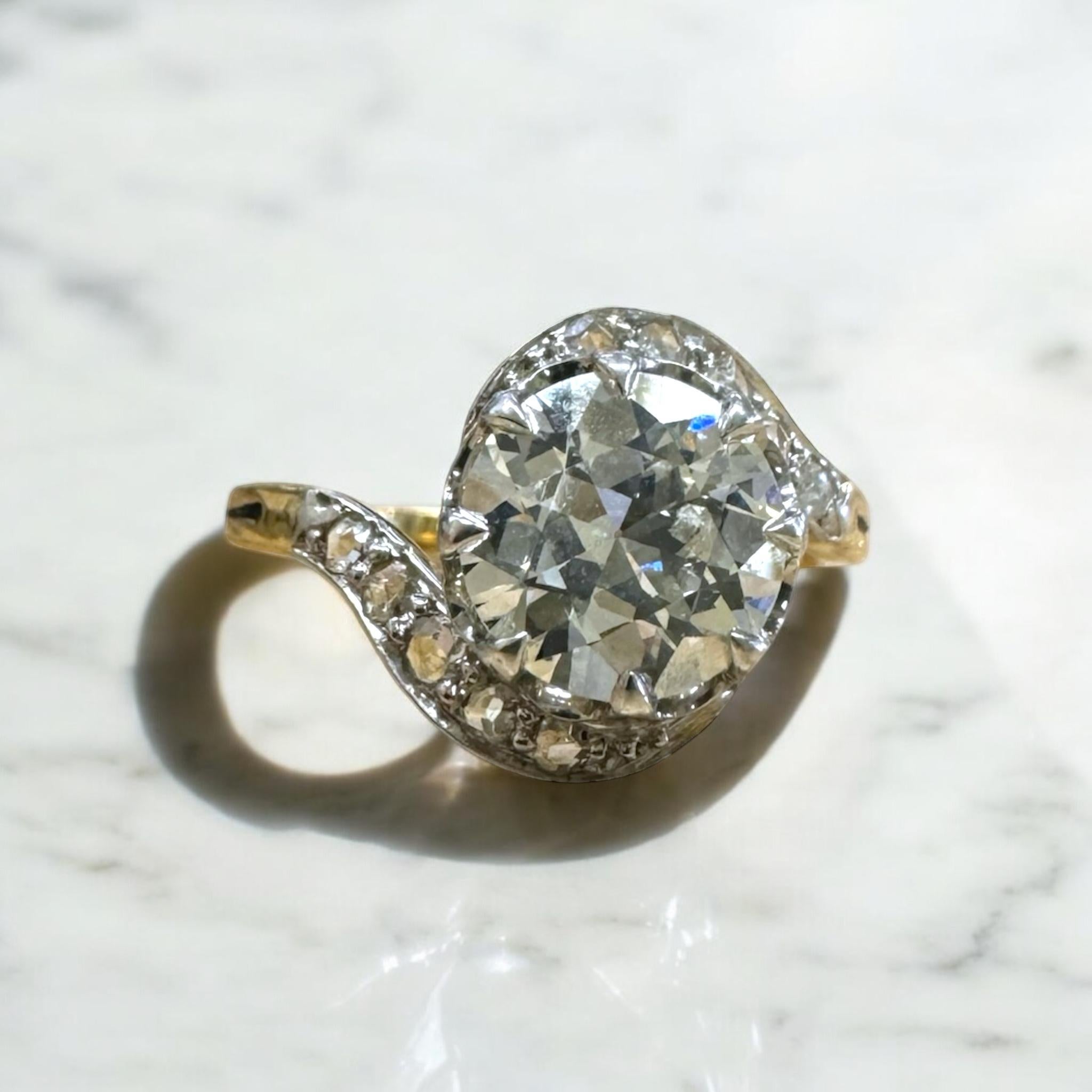 We are in love with this unique vintage beauty!!

Ring Details
Material: 18K yellow Gold & Platinum Top
Era: Art Nouveau 1890 - 1910
Head Width: 11.8mm
Head Height: 5.3mm
Shank Width: 1.8mm
Weight: 4.2 Grams
Finger Size: 6
Sizable Upon