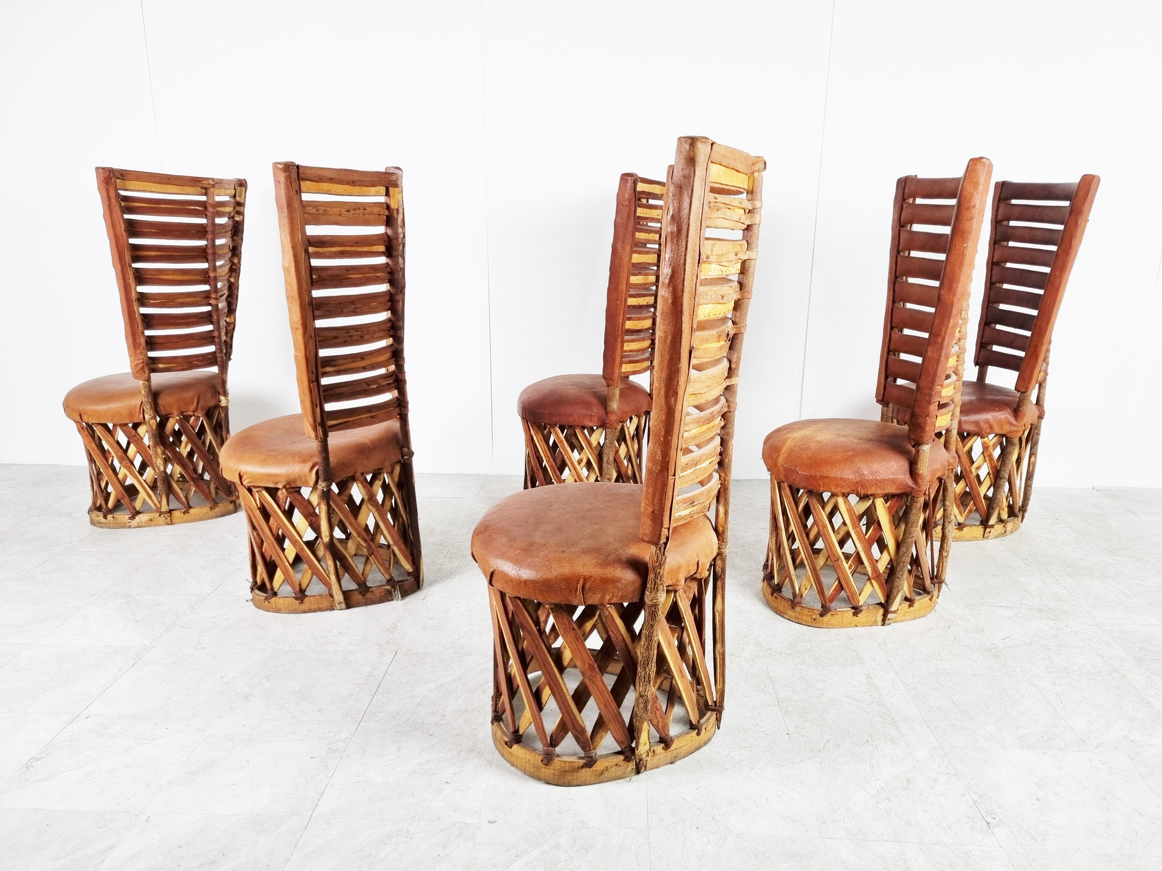 Remarkable high back art populaire or 'equipale' dining chairs from mexico.

Exotic weaved wooden frames upholstered with ostrich leather. The backrests are also upholstered creating a unique look and adding comfort.

1970s - Mexico

Good