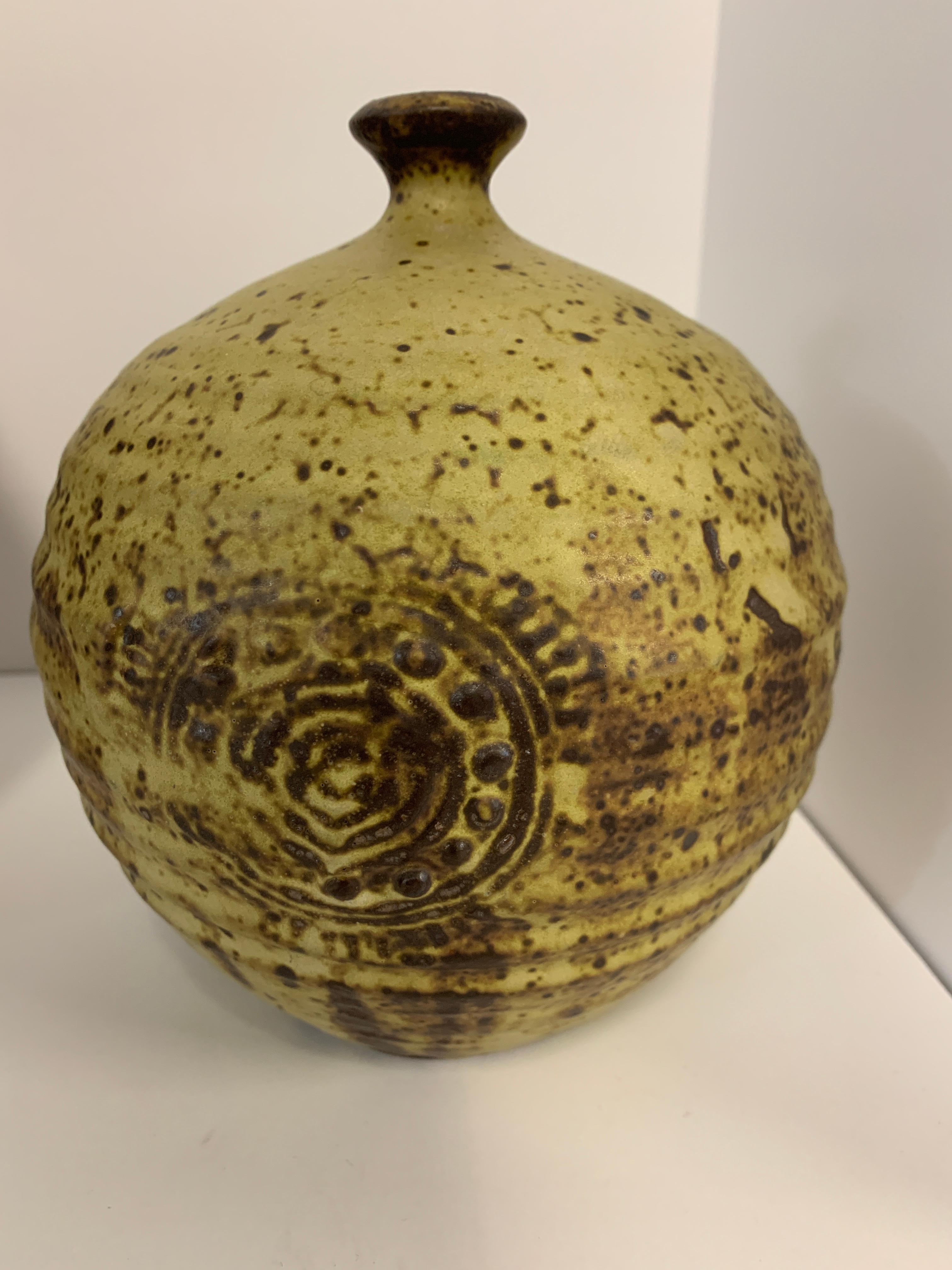 A group of 3 art pottery vases. They vary in size from 13.5 inches tall to 7.5 inches tall. The tallest is 13.5 inches tall and 3.5 inches in diameter. The smallest is 7.5 inches tall and 6.5 inches in diameter. They are in good age appropriate