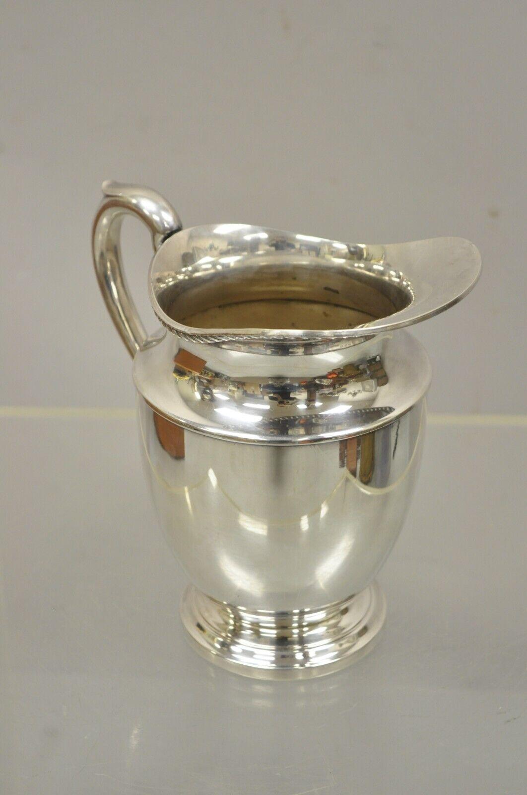 Vintage Art S. Co SPC 221 silver plated regency style water pitcher. Circa mid 20th century. Measurements: 8.25