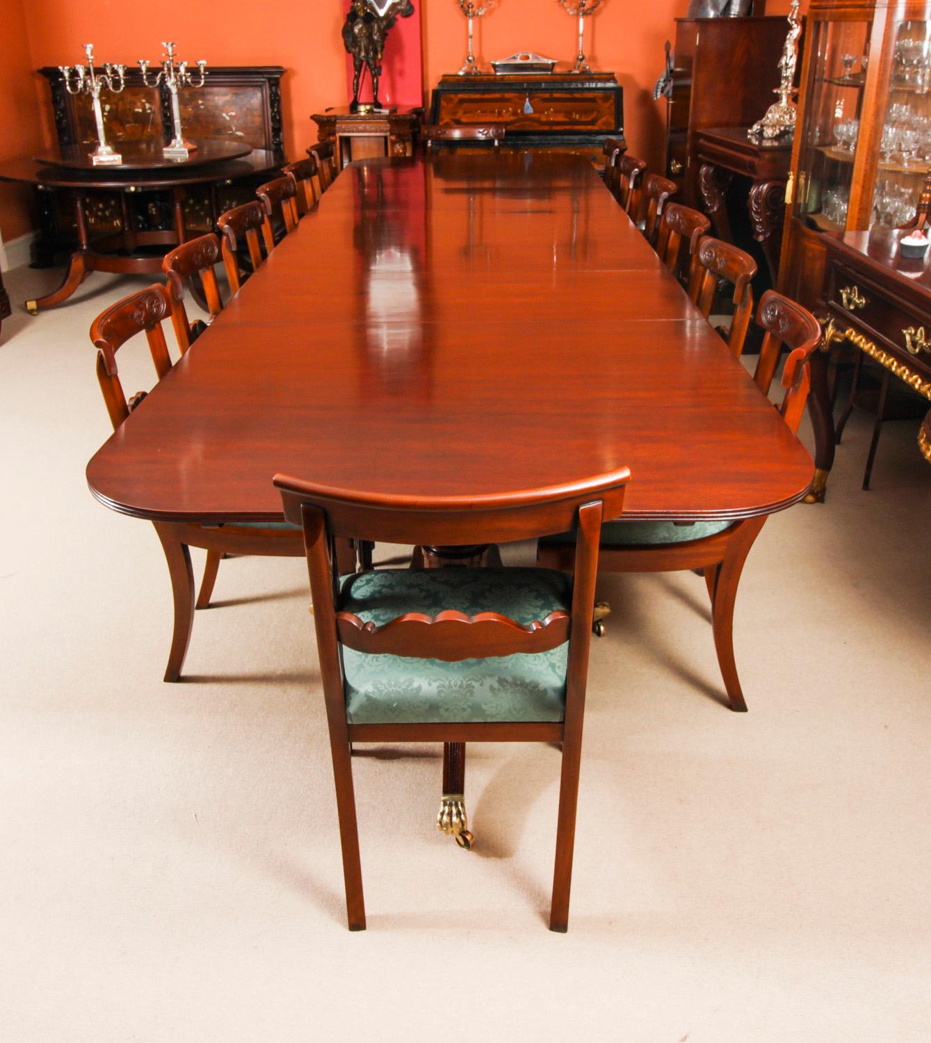 This is a superb dining set comprising a large Vintage handmade dining table in elegant George III style, by the master cabinetmakers Arthur Brett & Son, Norwich, mid-20th C in date, and the matching set of fourteen dining chairs.
The triple