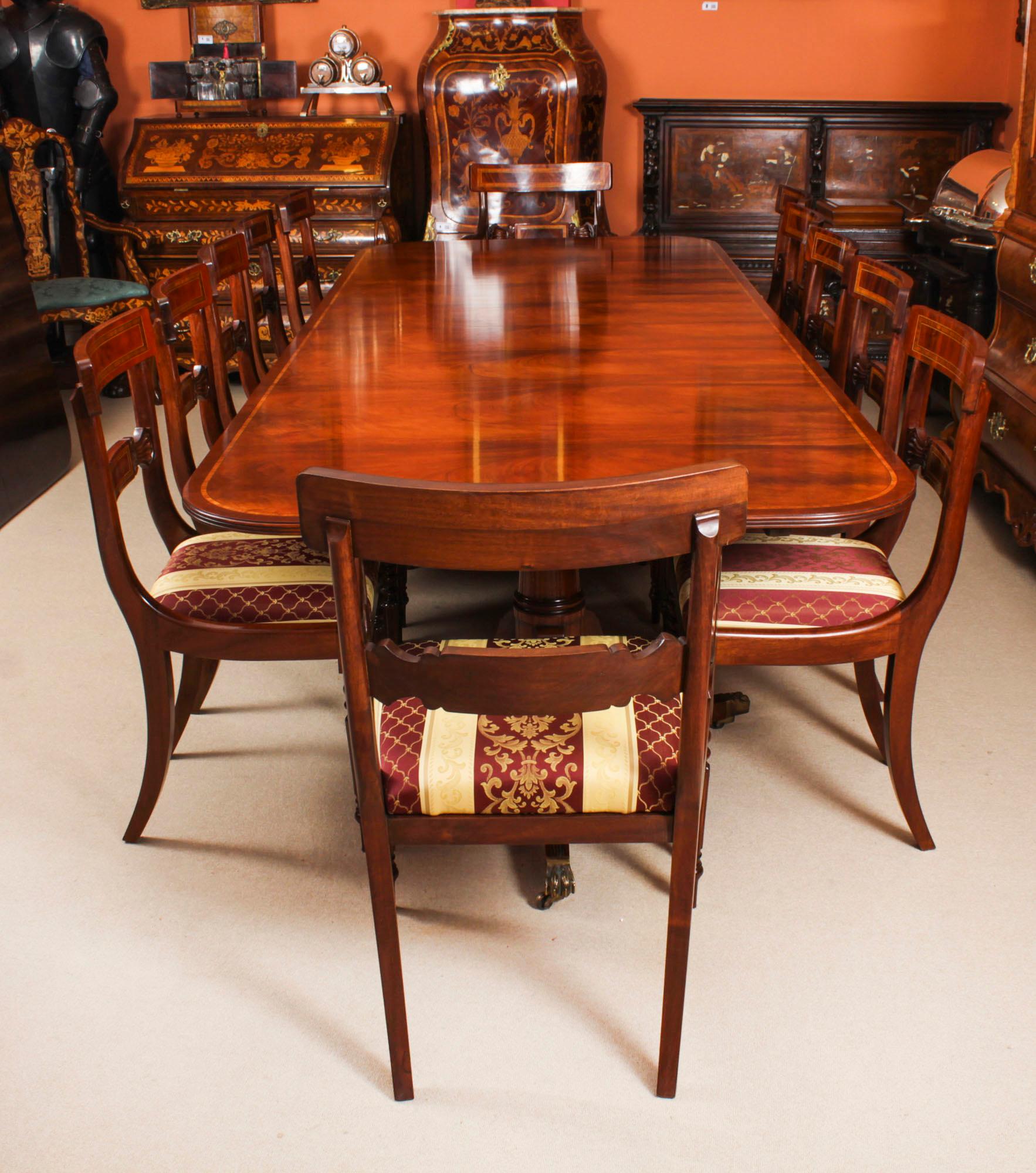 This is a superb large Vintage handmade double pedestal dining table in elegant George III style, by the master cabinetmakers Arthur Brett & Son, Norwich, crafted in flame mahogany with wood banding, numbered 761401 and dating from the mid 20th