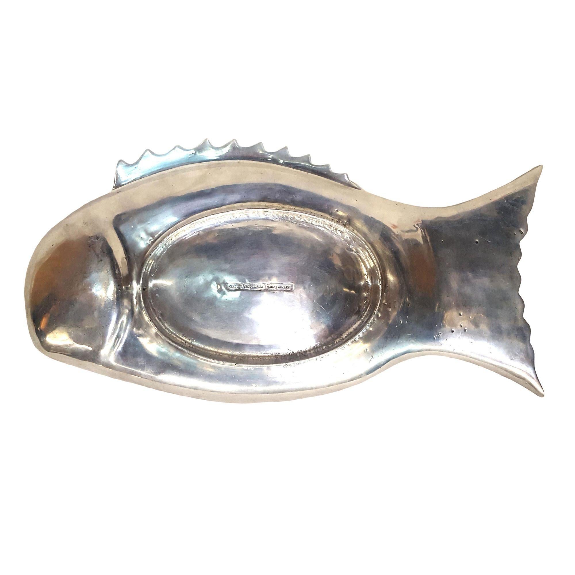 Vintage Arthur Court Aluminum Fish Serving Platter

Year manufactured: 1975
Dimensions: 24 inches long X 13 inches wide X 2-1/2 inches tall

Info: Gorgeous aluminum fish serving platter designed by Arthur Court in 1975. The piece has intricate