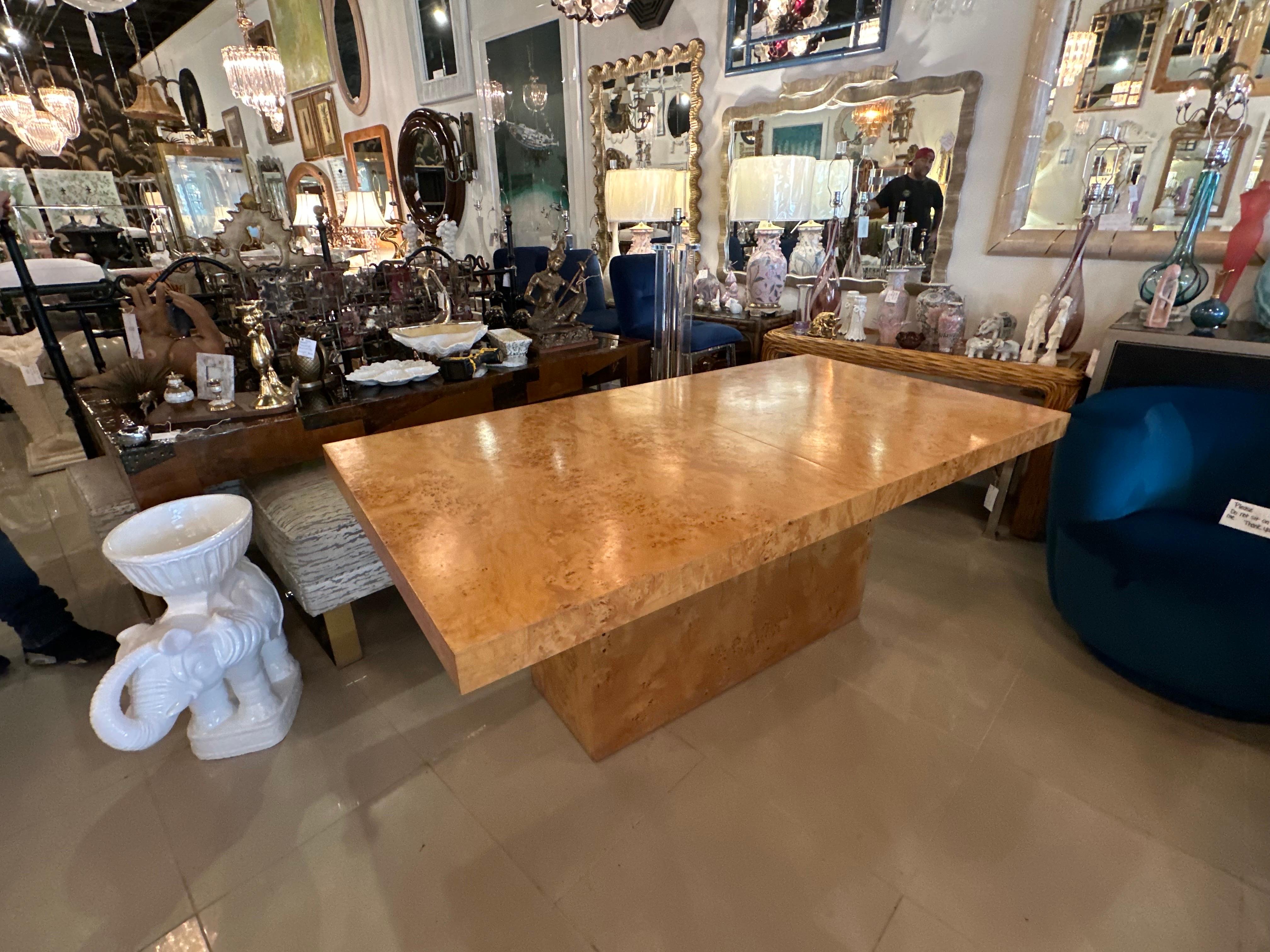 Beautiful Burled Burl Wood Olivewood dining table by Arthur Umanoff for Dillingham. This pedestal table comes with the 2 extension leaves which are housed in the pedestal base. The table closed with no leaves is 72