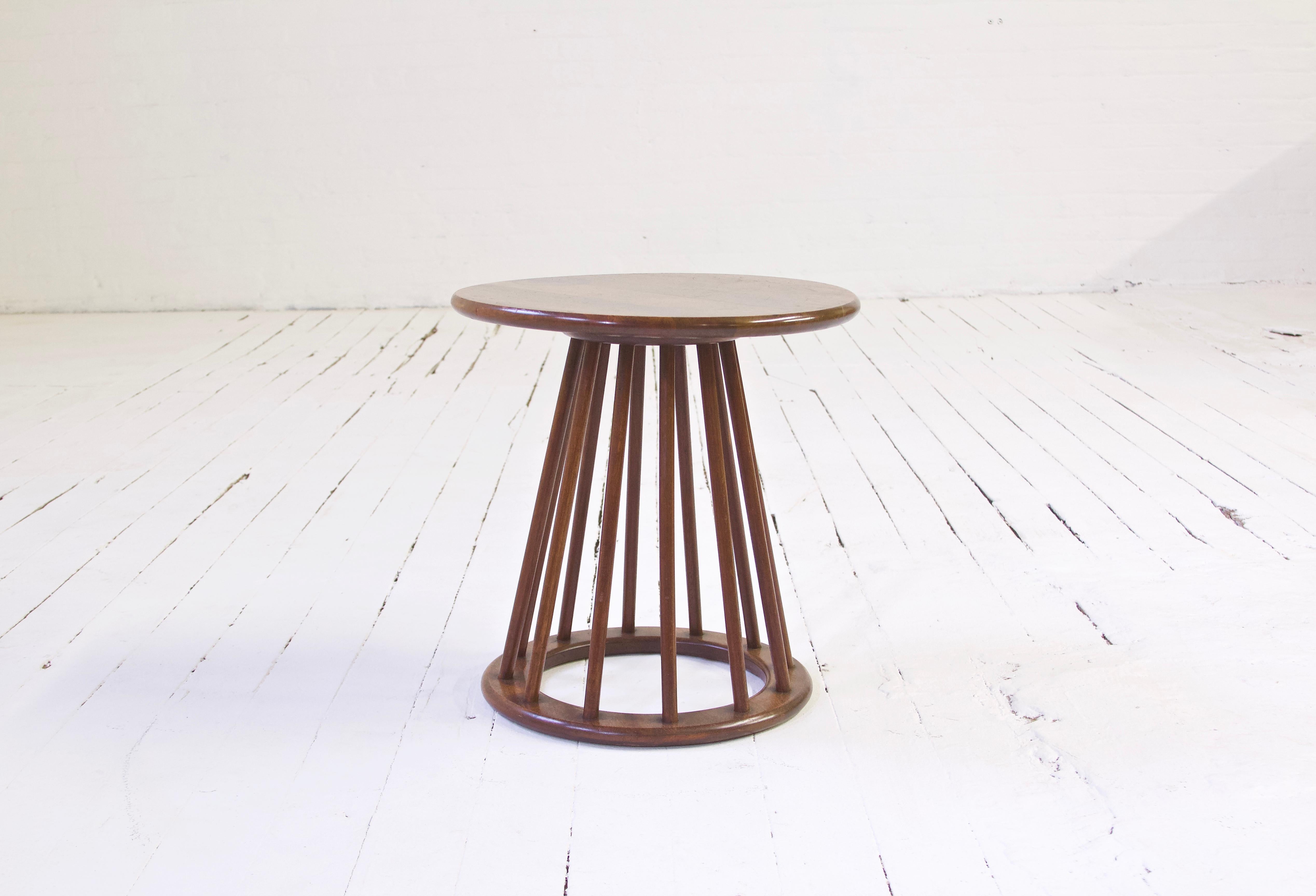 A Classic piece of Mid-Century Modern Americana--Arthur Umanoff's petite but well-conceived spindle-base end table in solid American Black Walnut. Works well as a Stand for plants or a decorative element, occasional table, and can be used gently as