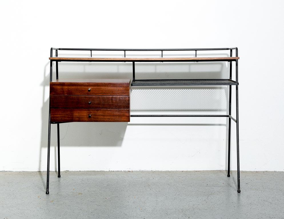 Vintage 'student' desk by Arthur Umanoff. Black iron frame and shelf with walnut top and drawers. Brass-plated pulls with plenty of patina.