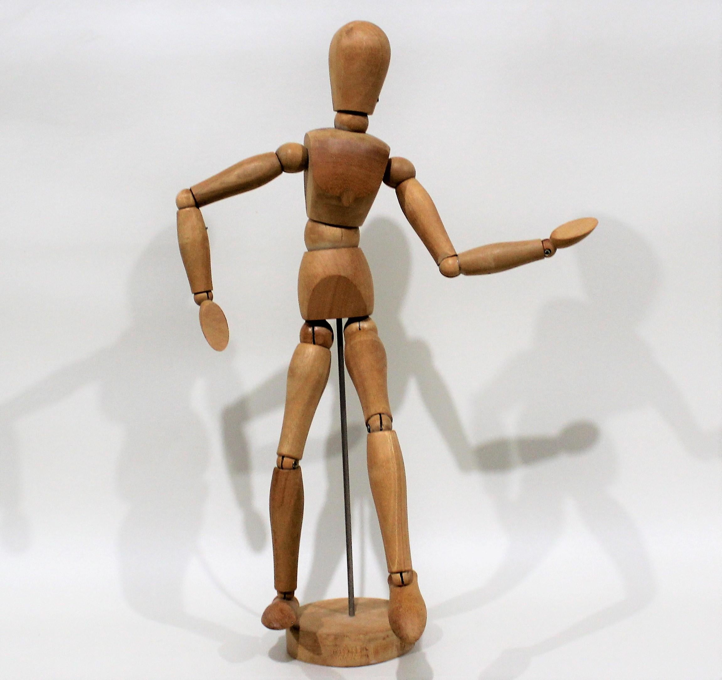 Vintage articulated and jointed wooden metal figure.