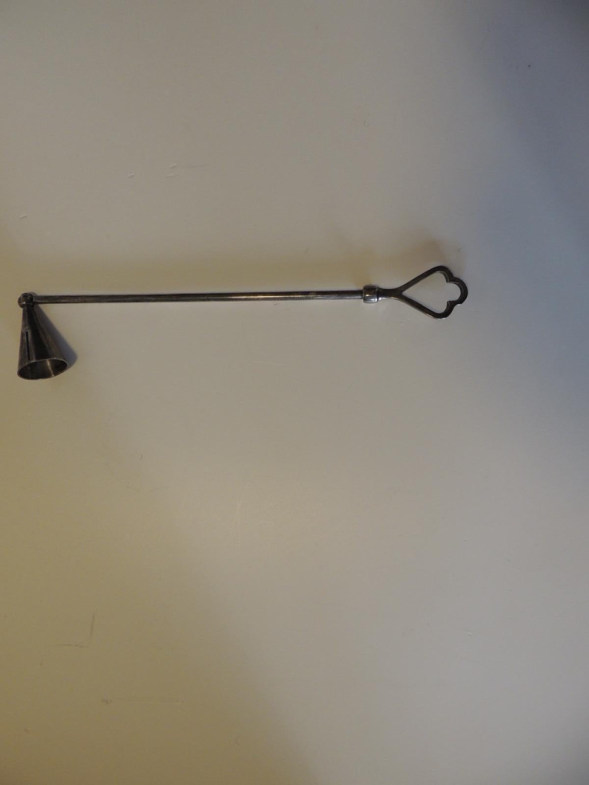 Vintage articulated polished chrome candle snuffer
with pierced handle.
Size: 13