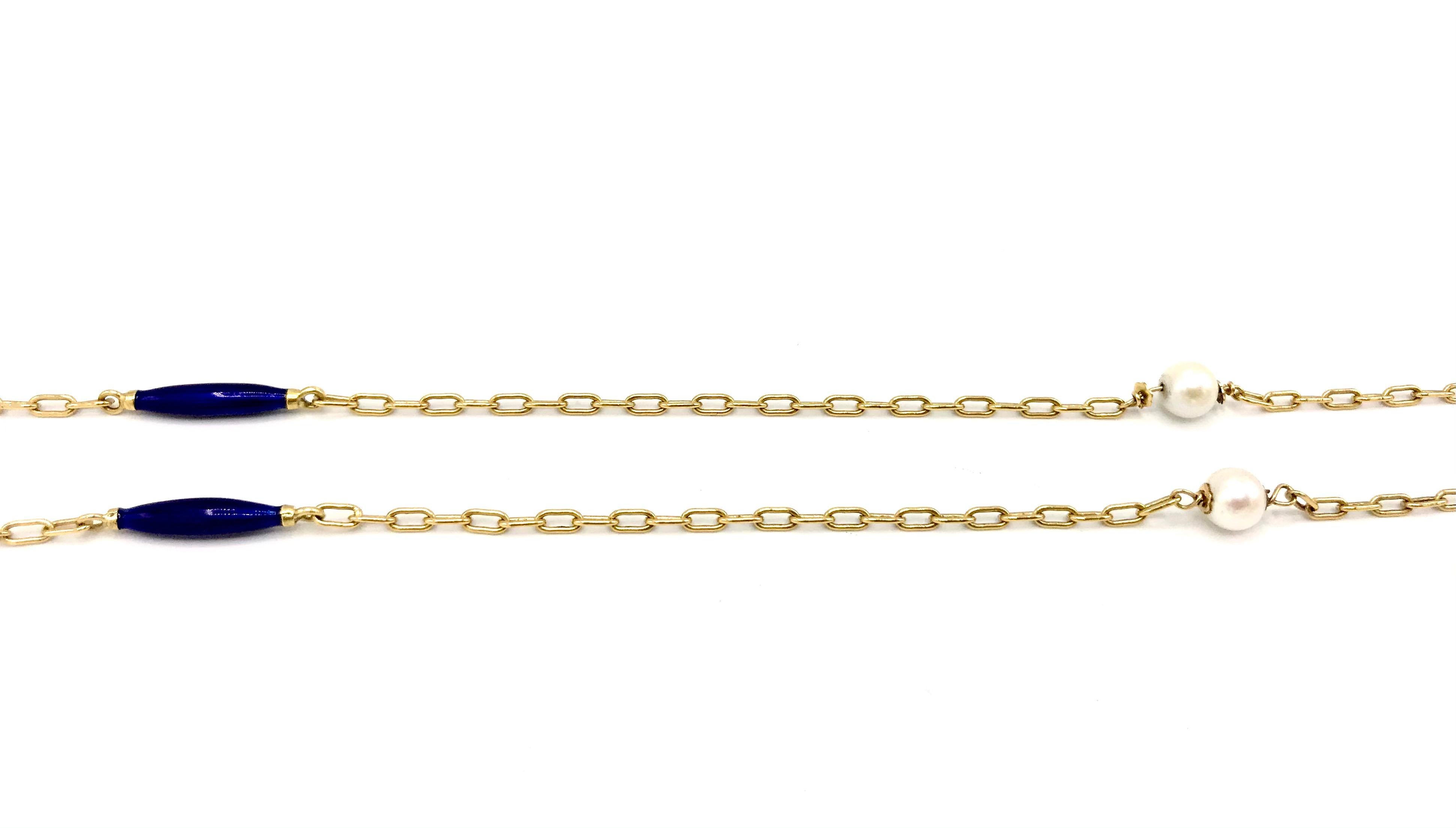 Delicate vintage chain necklace made of 18k yellow gold features enamel and pearl. 
Stamped with a maker's mark and a hallmark for 18k gold.
Measurements: 32