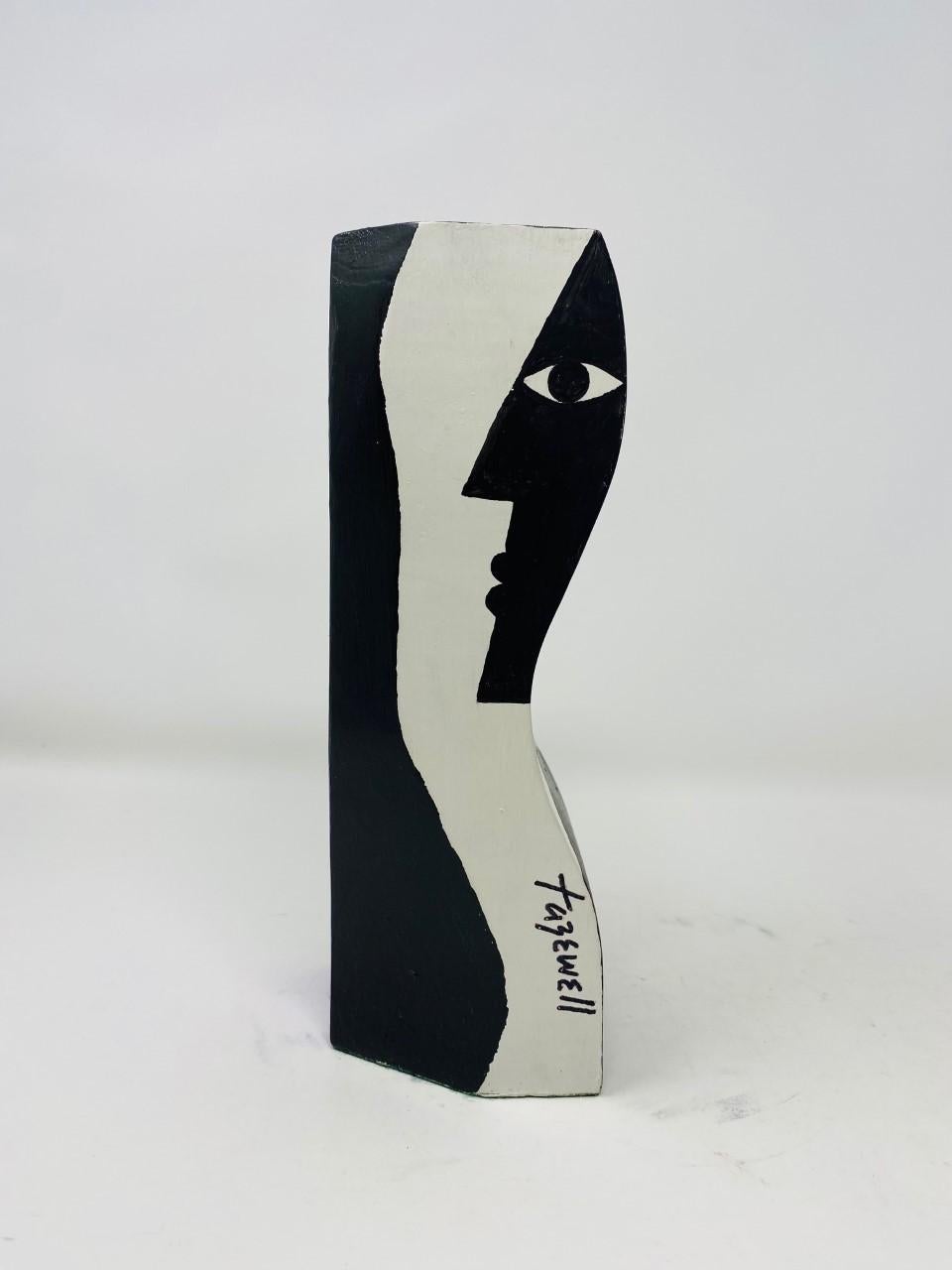 Beautiful artist candleholder by Tazewell. Handmade piece by artist Tazewell that combines whimsical and highly graphic details. The candleholder is crafted out of a single piece of wood with a variety of images on each side. On one side, a male