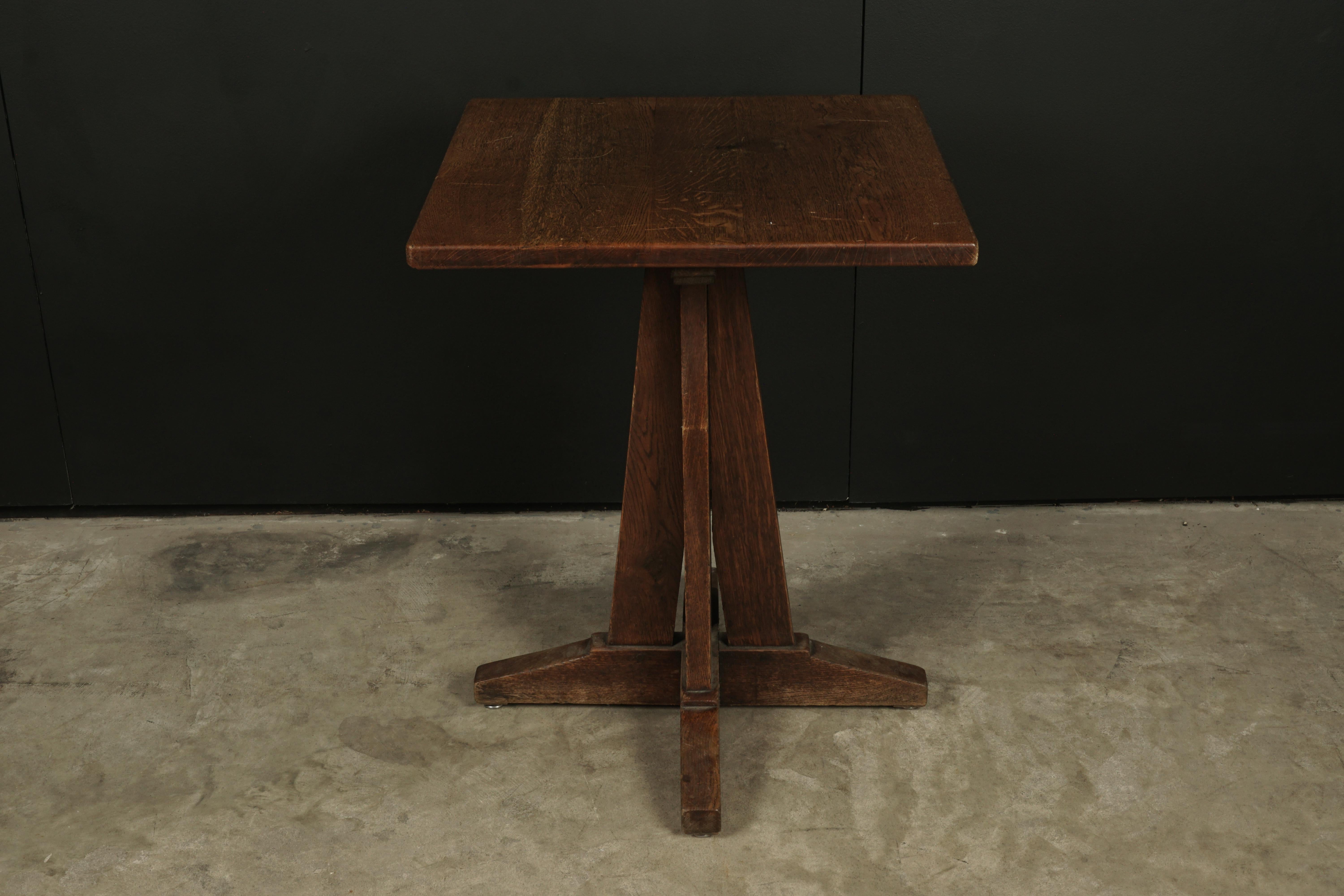 Vintage Arts & Crafts style Bistro table from France, 1960s. Solid oak construction with nice wear and patina. Unusual model.