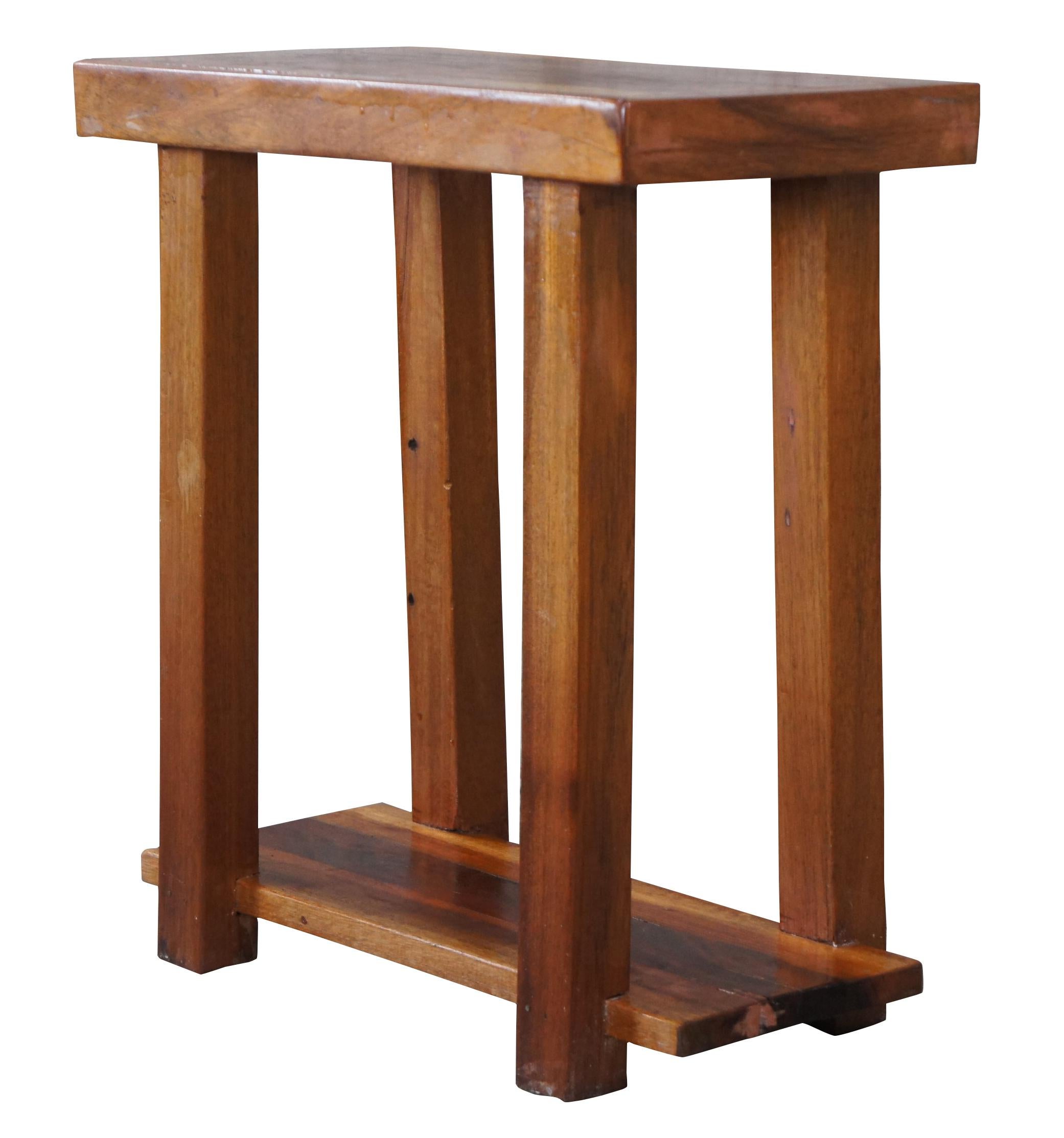 Vintage arts and crafts side table. Made of pine, featuring rectangular form with two tiers connecting square legs. Measure: 20