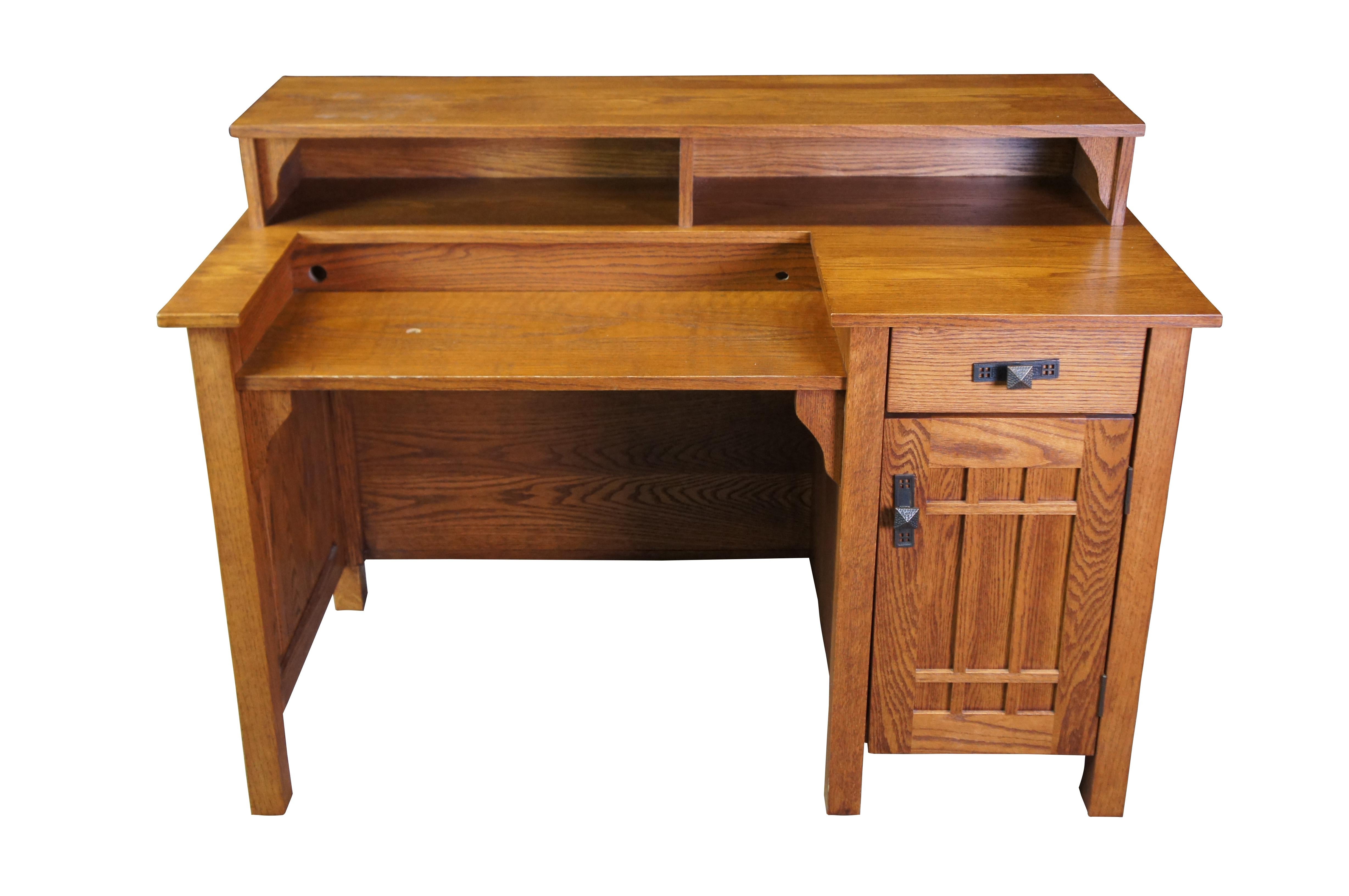 Handmade American craftsman writing desk.  Features Mission styling in oak with a central keyboard or laptop area in front of cubbies next to a dovetailed drawer and lower cabinet for desktop tower, books or other collectibles.  Working area has