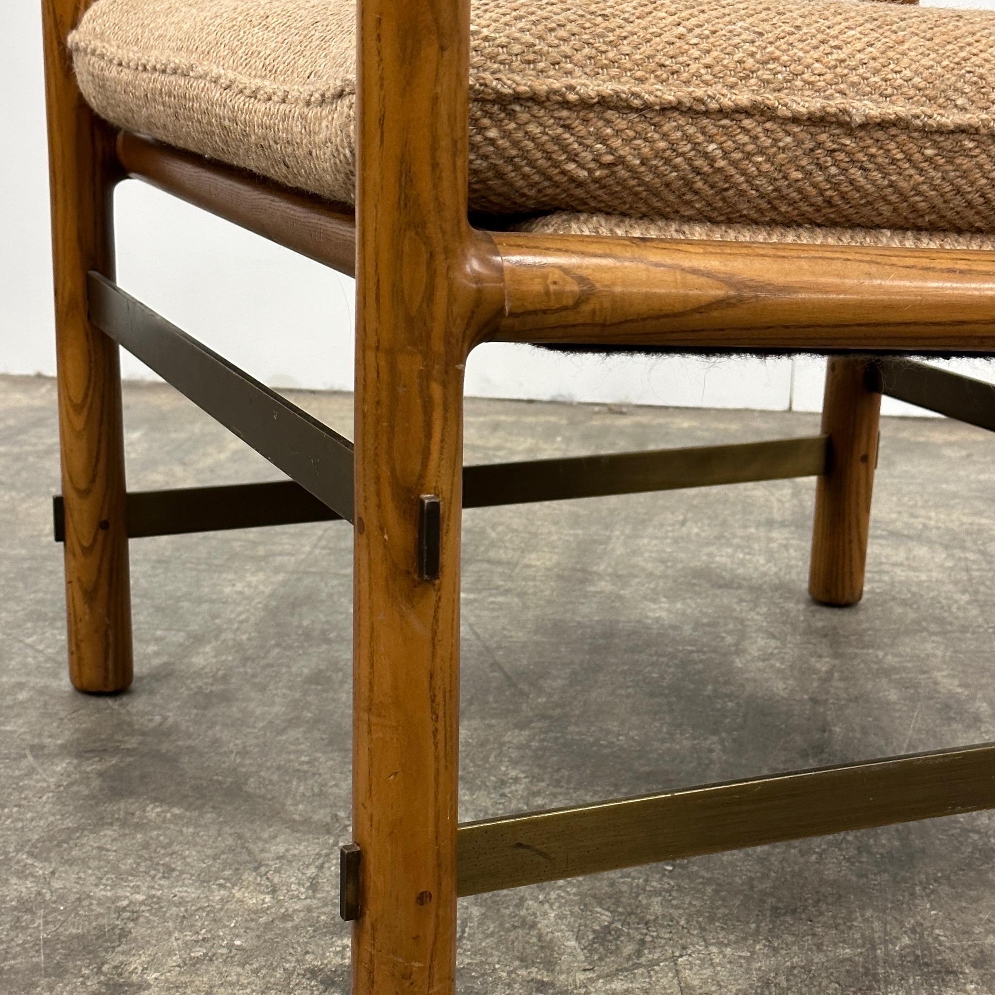 c. 1970s. Ash frame with original wool upholstery. Brass bars on legs. Tagged.