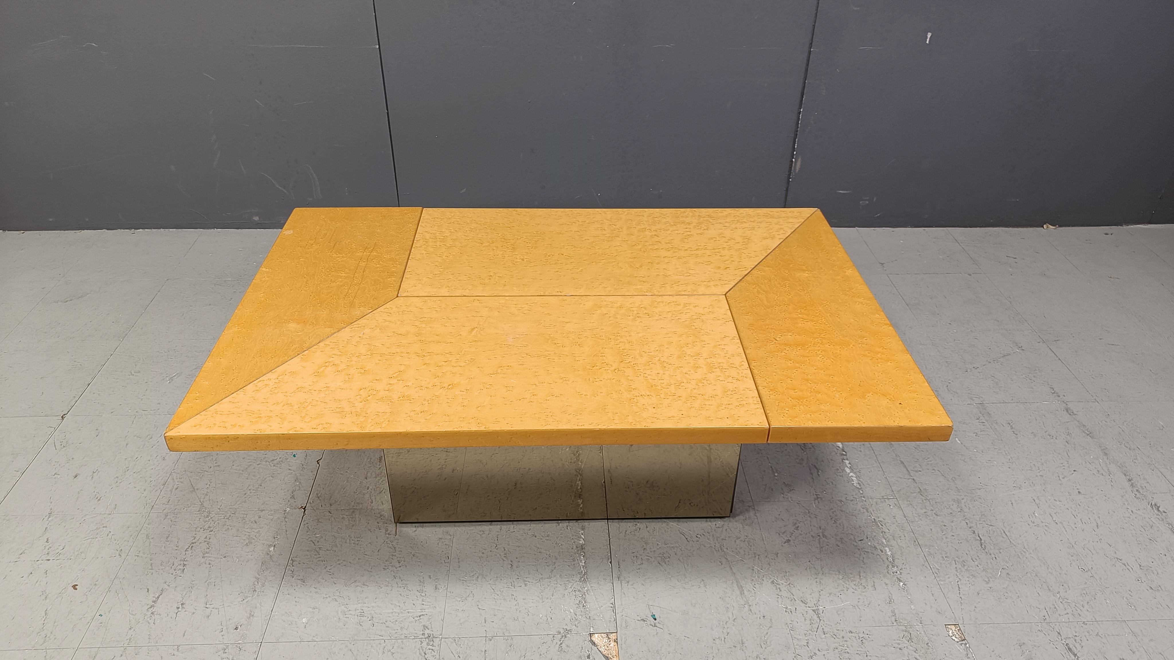 Ash wood coffee table designed by Paul Michel.

This luxurious coffee table is cleverly designed and slides open to reveal a mirrored spacious looking dry bar with the original plexiglass bottle holders.

The use of mirrored glass both inside and