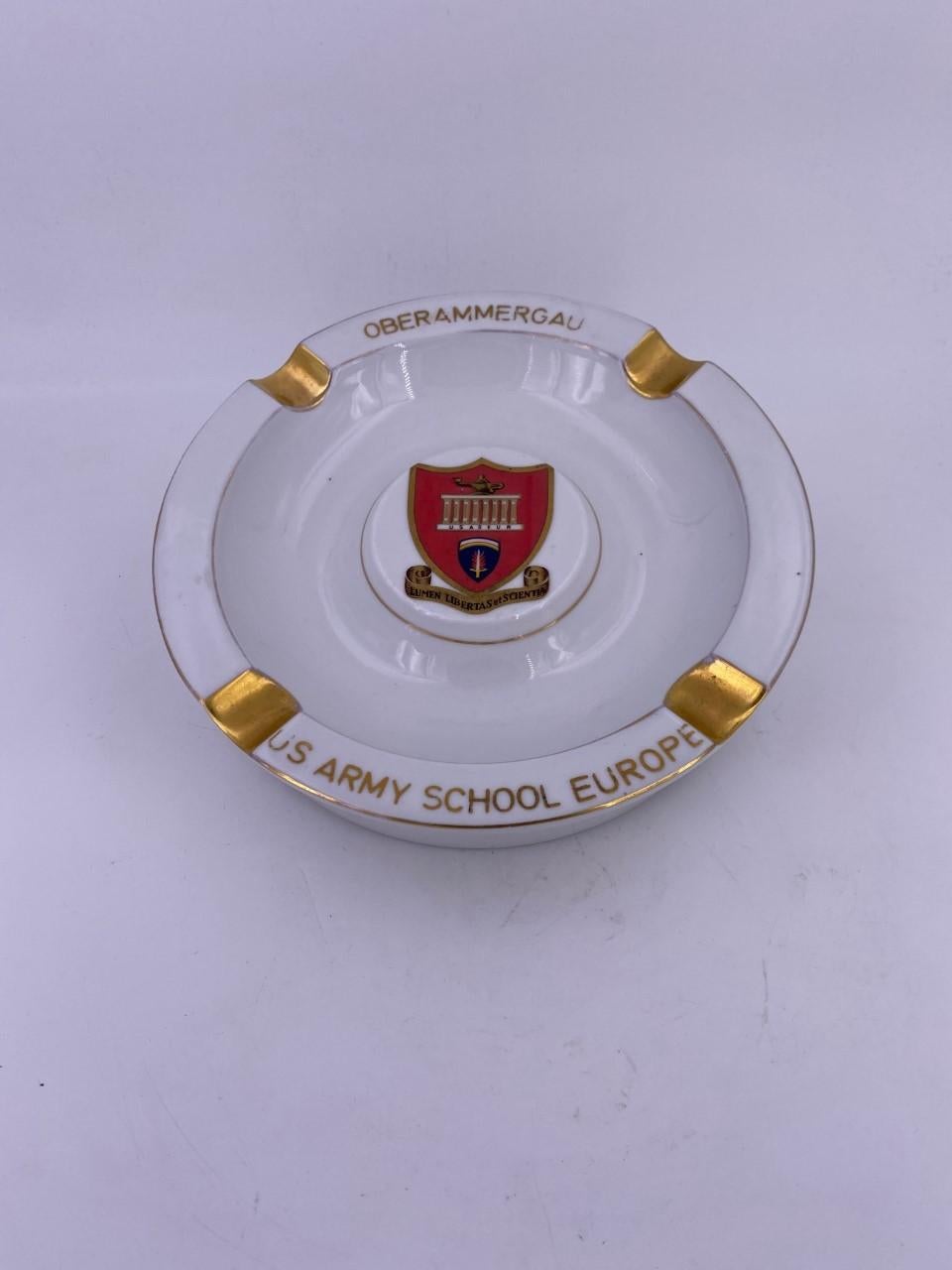 Vintage ceramic ashtray with Imagery of the US Oberammergau US Army School established in Germany in the 1960s. Ashtray is in good condition.