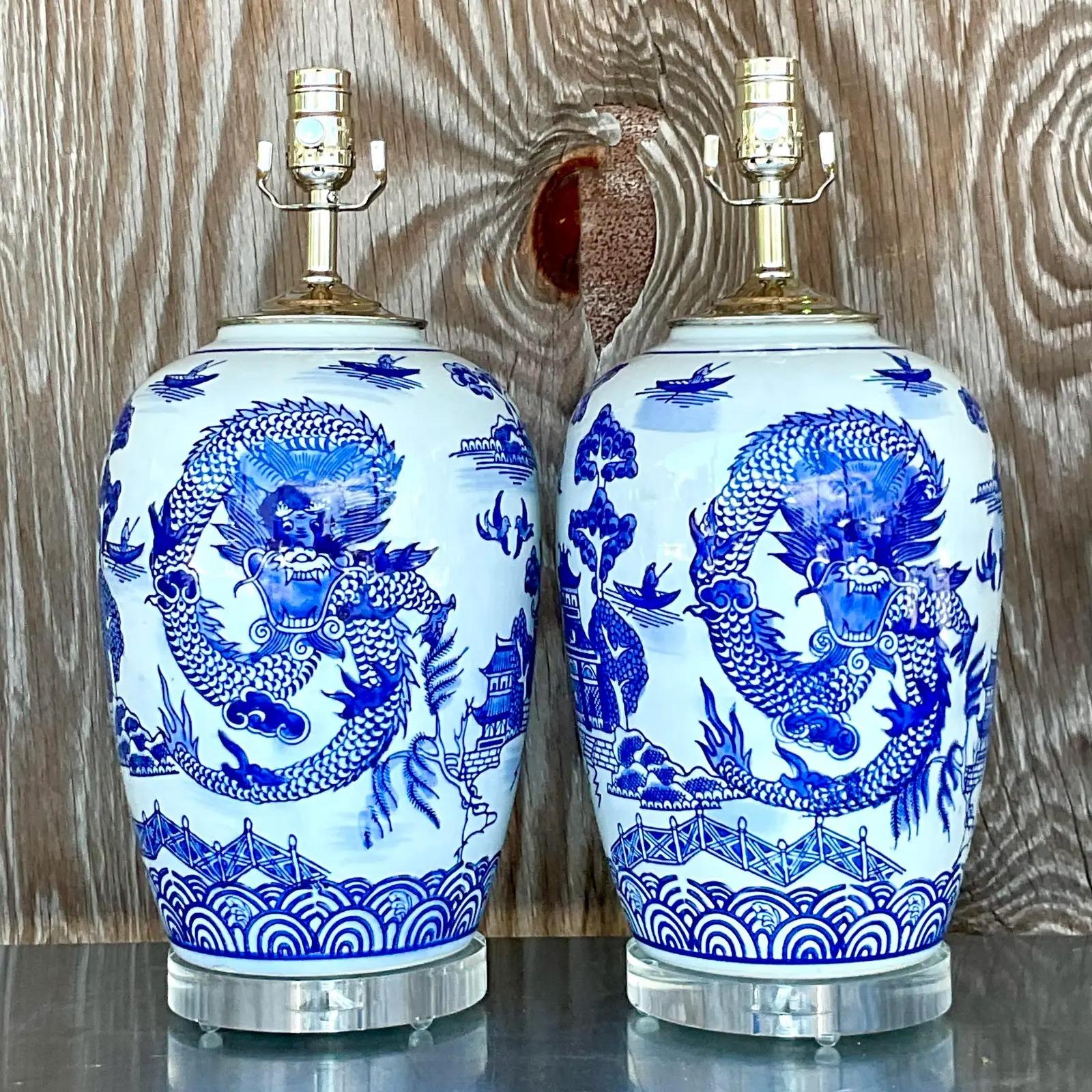 North American Vintage Asian Blue and White Dragon Ceramic Lamps, a Pair